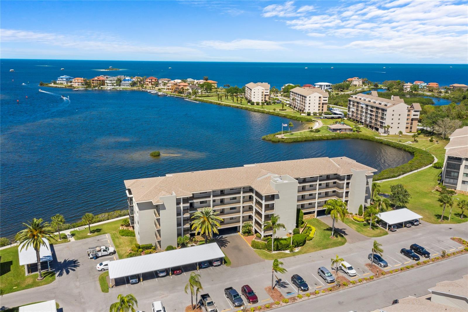 Is it your dream to live in Paradise? Imagine waking up EVERY DAY to the GULF of AMERICA right outside of your bedroom window? Don't miss this opportunity. This two bedroom, two bath unit has many upgrades, to list a few: The kitchen has been renovated (approx 3 yr ago) with new cabinets, stainless appliances, new stove and microwave, granite countertops, new backsplash, updated sink/faucet, new fan/lights, corner bread box, mirrored closet doors to washer/dryer/utility closet. New plantation shutter and new screen. The dining room offers a breakfast bar, built in cabinetry, overhead adjustable light, decorative beadboard and crown. The living room with crown and chair rail, ceiling fan, sliding door to lanai. The lanai has new impact rated exterior sliding doors and new interior sliding doors from living room and from Primary Suite. Also a new ceiling fan/light. The Primary bedroom has an impact rated window and new sliding door to lanai, direct view of the GULF, En suite bath with walk in shower, large walk in closet with mirrored doors and cedar lined walls, chair railing and crown molding, Decorative sink top. Hall to guest bath with two closets for additional storage. Guest bath renovated in last 3 years with new sink, new faucet, raised toilet, new flooring, new wallpaper and new light fixture. Guest bedroom renovated with built in desk, wall to wall shelving and Murphy bed, fan/light, mirror closet doors, new screen on window. Gorgeous view of Gulf of America from almost every room. View boat traffic, stilt houses, the bay where dolphin, manatee and fish come to feed. Close to Clubhouse and Brent Street pool (behind clubhouse) which offers ample lounge seating, cabana, gas grill. Clubhouse features a library, fitness, game tables, card rooms, activities. Owner also has access to pool on Aquila Street. Tennis/Pickleball, Putting green, community boat ramp, waterfront board walk. Dues include: trash, cable. wifi, internet, use of the two pools, amenities, management, 24/7 gate guard, exterior maintenance, lawn/landscaping, maintenance of all amenities, roof, exterior insurance (flood and hazard) and escrows for future maintenance. Milestone inspections completed. NO ASSESSMENTS FOR REPAIRS. Reports available. NO PETS. NOT AGE RESTRICTED.
Owner states AC 2020 (estimate), Hot water heater 2013. Buyer to verify.