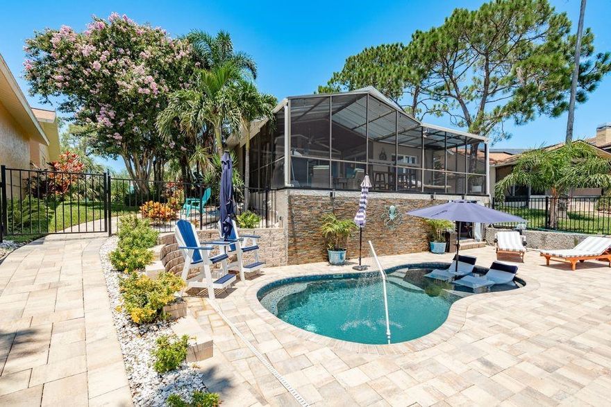Check out this Waterfront Paradise pool home located in Gulf Harbors Sea Forest!! Welcome to your slice of Coastal paradise. This home Never flooded in the hurricanes of 2024. This beautifully updated 2-bedroom home includes a flex room currently serving as a charming guest quarter with a custom queen -Murphy bed, offering comfort and versatility for visiting family and friends. Perfectly nestled in the prestigious Gulf Harbors Sea Forest community, your just steps from downtown New Port Richey's dining, shops, and parks and only a 10 min boat ride to the open Gulf of America with no bridges. Spend your days cruising the waterways, spotting dolphins, and watching breathtaking sunsets from your own backyard. Inside, warmth and style meet with Bruce Hardwood flooring throughout, tile accents, and motorized shades for effortless comfort. The open layout flows into your own private oasis, a 2023 pebble tech resort style pool, screened lanai, and a fully equipped outdoor kitchen with gas BBQ, sink, refrigerator, gas burner and kegerator- perfect for memorable evenings with friends. 2021 10,000 pound lift and nice dock, below level workshop, currently the owners personal bait shop- a boaters Dream!! Thoughtful updates include a 2023 roof, 6-inch gutters, and Hurricane resistant windows throughout. As a resident, you'll enjoy exclusive community amenities and access to a private beach club, where every day feels like a vacation. This is waterfront living at its most relaxed and refined- where every sunset is better than the last!! Call today