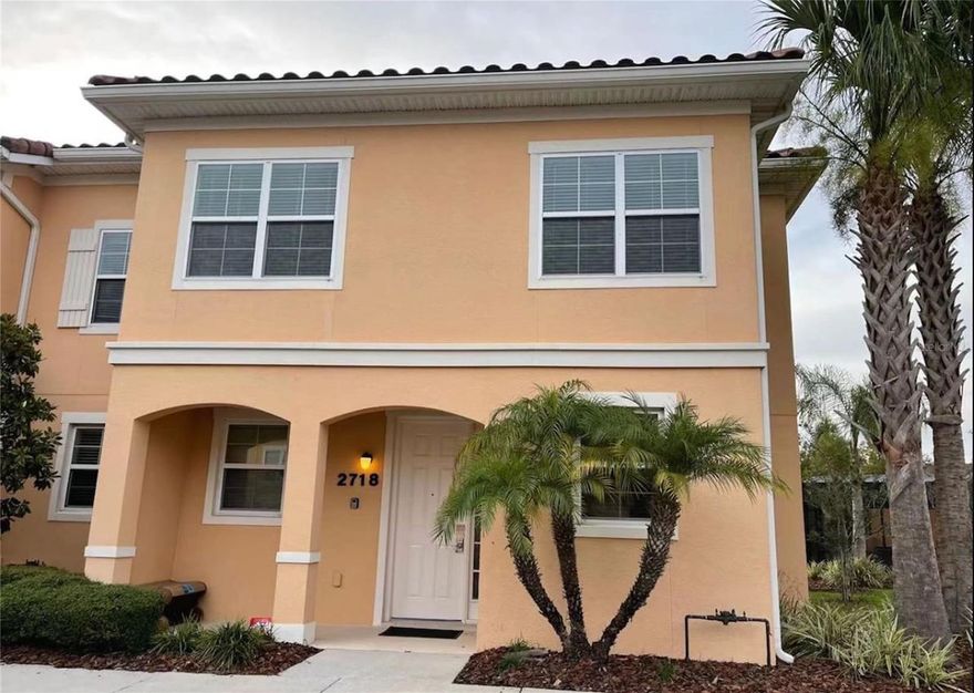 Turnkey, fully furnished 3-bedroom, 2.5-bathroom end-unit townhome in the gated Regal Oaks Resort community just minutes from Disney. This two-story property features an open-concept living and dining area on the first floor, with all bedrooms located upstairs. Tile and laminate flooring run throughout the entire home. The spacious primary suite offers a private ensuite bathroom and balcony. Enjoy relaxing water views from the screened private lanai. Regal Oaks offers resort-style amenities including a large community pool, water slide, clubhouse, game room, restaurant, and tiki bar. Conveniently located near Walt Disney World, major attractions, shopping, dining, and within walk distance to the popular Old Town entertainment district. Zoned for both short-term and long-term rentals, making it an excellent vacation home, income-producing investment property, or primary residence. Some furniture may have been updated. Room measurements are approximate.
