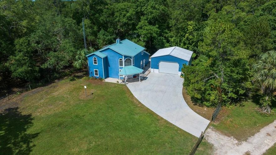 One or more photo(s) has been virtually staged. Back on the market and even better than before! Discover the best of both worlds in this beautifully updated one-owner home nestled on 5.42 acres zoned A1, perfect for animal lovers, hobby farmers, or anyone craving wide open space and privacy. Set at the end of a quiet drive, this 3-bedroom, 2-bath retreat is a hidden gem designed for those who love the land but don’t want to sacrifice style or modern updates. Step inside to a light-filled layout where fresh neutral tones, custom picture windows, and quality updated finishes bring warmth and calm to every corner. The fully remodeled kitchen is the heart of the home, featuring granite countertops, new stainless steel appliances, and countertop bar seating. The spacious family room connects seamlessly to the formal dining room through French doors, making it ideal for special gatherings. The formal living room’s floor-to-ceiling brick fireplace adds rustic charm and comfort, while two updated guest bedrooms and a modern full bath offer space for visitors or family. Upstairs, the private primary suite is a private retreat with a brand new spa-like bathroom boasting dual vanities, a soaking tub, and a glass-enclosed dual shower. An office loft and private screened-in deck overlooking the woods make it easy to unwind and work remotely. A portion of the front acreage is fenced, and there is a newly built 30x30 detached garage with electric that provides ample space for equipment, projects, or storage. Additional improvements include a 2014 solar-enhanced water heater, a 2025 water softener system, an annual termite bond, and a 2019 HVAC system. The durable metal roof, installed in 2014, ensures long-lasting protection and peace of mind. One-of-a-kind features like the handcrafted oak and ash staircase showcase the care and craftsmanship that make this home truly special. With agricultural zoning, this property offers endless possibilities for farming, livestock, or simply enjoying wide-open country living. The acreage extends all the way to Hwy 315, providing both convenience and opportunity for future use. Located just 15 minutes from Ocala and convenient to both I-75 and I-95, it’s an ideal home base for travelers, commuters, and equestrian lovers alike, especially with the World Equestrian Center close by. Survey and other supporting documents available, no HOA.