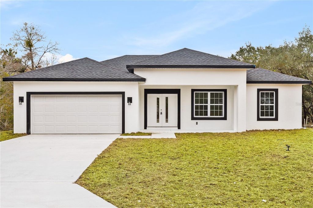 Photo of 1215 W Hedgewood Lane, Citrus Springs, FL 34434 (MLS # O6372448)
