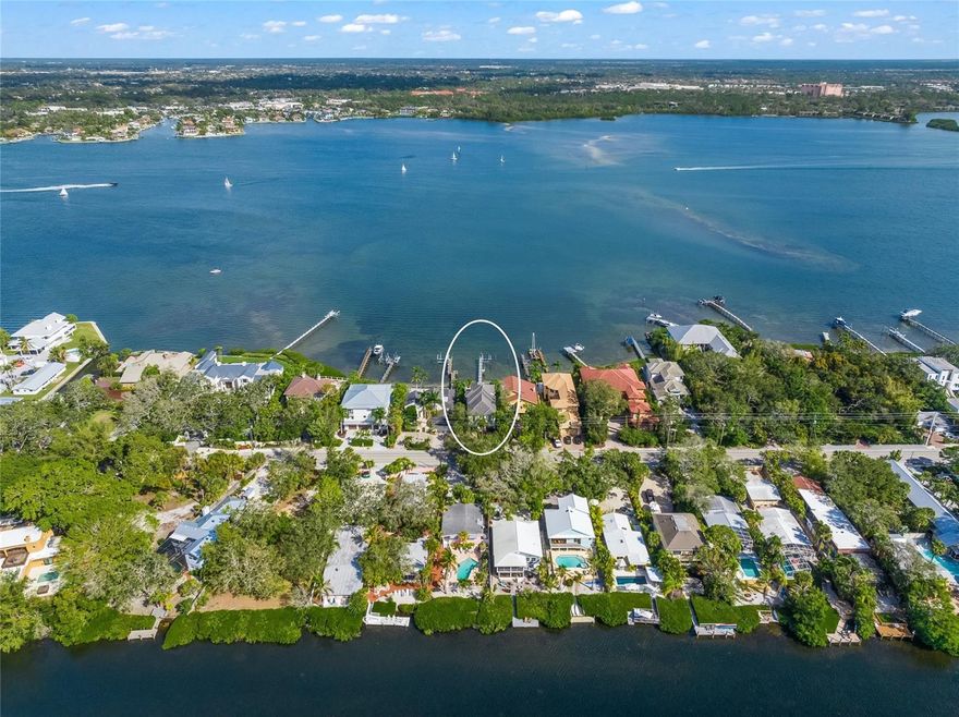 This is the one * QUALITY BUILT CUSTOM HOME BY JOHN CANNON * PANORAMIC BAY VIEWS ARE A MUST-SEE! * DEEP WATER DOCK, NO BRIDGES TO THE BAY & INTERCOASTAL WATERWAY (ICW) & a SHORT BOAT RIDE TO THE GULF OF MEXICO * This METICULOUSLY MAINTAINED HOME is 10 years young and SITUATED ON THE QUIET SOUTH SIDE OF SIESTA KEY * This NEWER BUILT HOME FEATURES 2 PRIMARY SUITES, ONE UPSTAIRS & ONE DOWN * 4 Bedrooms, ALL ARE EN-SUITES with WALK-IN CLOSETS * PLUS a separate Den/Office * The upstairs Primary Suite features a Spa-style Bath with dual closets and a spacious 13x10 Balcony Retreat with ENDLESS BAY VIEWS * The generously-sized Great Room is open to the Chef's Kitchen with separate island making it perfect for entertaining * The Kitchen is a CULINARY DELIGHT with wood cabinets, solid surface countertops, stainless steel appliances, a 6 BURNER GAS COOK-TOP and a hidden walk-in Butler's Pantry * Great Room and Dining Room have volume ceilings and 10 foot sliding glass doors * The interior is open, light & bright * You will live comfortably here and love the EXQUISITE ARCHITECTURAL DETAILS at every turn and the ABUNDANCE OF NATURAL LIGHT * IMPACT WINDOWS & DOORS for storm protection * NATURAL GAS * POOL-SIDE AT YOUR PRIVATE OASIS IS OUTDOOR LIVING AT ITS VERY BEST * Large Covered Lanai with Outdoor Kitchen * GAS HEATED POOL & SPA with a Pool Bath and a PRIVATE BEACH NEXT TO YOUR POOL * FOR YOUR BOATING PLEASURE, YOUR PRIVATE DOCK FEATURES COMPOSITE DECKING, 10,000lb BOAT LIFT, WATER & ELECTRIC, CUSTOM LIGHTING AND STAIR TO WATER ACCESS * DEEP WATER LIFT IS 4FT AT LOW TIDE * EASY ACCESS TO THE ICW & GULF OF MEXICO, and a quick boat ride to your favorite restaurant or sand bar! * This is the lifestyle you & your family are looking for * It's a great home for entertaining or simply relaxing in your slice of paradise * Nestled in this PEACEFUL LOCATION away from the hustle & bustle yet close to all of Siesta Key & Sarasota's amenities, and just a half mile to Turtle Beach * Everything you are looking for is in this home * One look & you'll fall in love * Start making fabulous memories today!