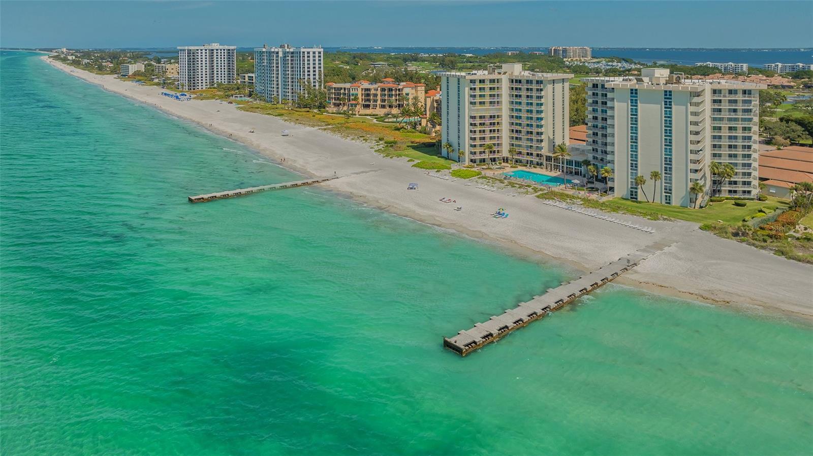 Embrace beachfront living with this two-bedroom, two-bath residence, offering mesmerizing direct views of the Gulf of Mexico. An exceptional feature is the oversized private terrace with breathtaking ocean views, a rarity in beachfront properties. Your private rooftop terrace seamlessly connects to your balcony, extending your outdoor oasis to over 60 feet. Imagine stepping outside and being greeted by the gentle sea breeze, with the vast expanse of the ocean stretching out before you in all its splendor. This generous space offers the ideal retreat for enjoying the coastal lifestyle to the fullest. Whether you're hosting lively gatherings with friends or simply unwinding, you'll have ample room to spread out and make the most of this idyllic setting without leaving the comfort of your home. Retreat to the spacious primary suite, where panoramic ocean views and an en-suite bath redefine serenity. The second bedroom serves as an inviting guest retreat or productive home office. The open-concept living and dining area are for entertaining or simply relaxing while taking in the incredible scenery. The kitchen is equipped with stainless steel appliances and abundant cabinet space for all your culinary needs. The Islander Club is a sought-after community with 400 feet of private beach frontage. Islander Club offers residents on-site management, a heated pool, renovated clubhouse, billiards and table tennis room, fitness center, saunas and two Har-Tru tennis courts. The shopping, dining and cultural attractions of St. Armands Circle and downtown Sarasota are just a short drive away.