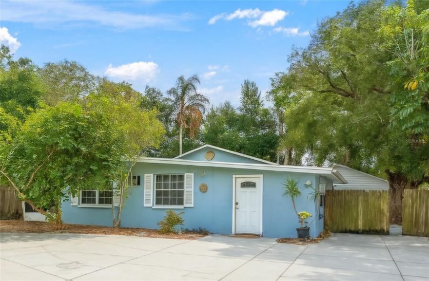 A unique opportunity & an amazing location for this solid, concrete construction home. It has  a generous (74 x 125, 9,274 sq ft. ) lot with large, established trees located in the highly desirable Palm Harbor neighborhood.  This 2 bedroom, 2 bathroom 1,291 sq block home with a large detached ( 20x21, 420 sq ft ) garage with lots of storage space & another shed that can be used for a workshed or additional storage.  The backyard is fenced in, offering privacy. Ample parking & a  double door gate that allows convenience to park your RV (with electric hook up,) or boats, toys, or multiple vehicles. This home also has 3 porches! One screened porch outside the living room, one covered porch outside the master bedroom & another in the backyard.
Just a short walk or golf cart ride (less than a mile) is the highly desired Palm Harbor University High School district  & YMCA.  And also less than a mile to the heart of the vibrant  downtown Palm harbor where you can enjoy local favorites like Fireside Pizza, Thirsty Marlin, Salty Lime Cantina, top-rated restaurants, trendy bars, great music, shopping, local attractions & the Pinellas Trail, , 
This home Features  a newer AC system (7/2023)  & a newer garage roof also approximately 1 years old. In addition, the washer and dryer alsoconvey.
With solid bones and room for updating, this home is ready for its next owner to bring their vision to life. Bring your imagination and creativity.  Make this unique property your own Florida lifestyle home. With no homeowner association & fees, nor restrictions,NO CDD & NOT in a flood zone ( X Flood zone!) you'll enjoy true freedom, and flexibility. This rare gem won’t last long!
