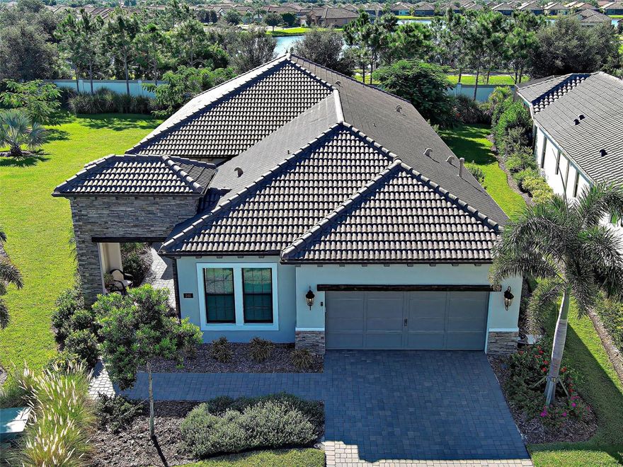 Welcome to ARIA in lovely Nokomis, Florida.  Developed by Neal Signature Homes.  A deed restricted, gated community with gorgeous resort style amenities including clubhouse, pool, state of the art fitness center, pickleball and entertainment area that overlooks lake and fountain.   On-site community manager.  Presenting the beautiful Vicenzo Model, built in 2022 with 2667 sq. ft., (heated and cooled) 3576 sq. ft. total.   3/BEDROOMS, 3/BATHROOMS, OFFICE, and 2-CAR GARAGE.  FEATURING A PRIVATE IN-LAW/GUEST SUITE W/SEPARATE ENTRANCE.   BEING OFFERED FURNISHED (or unfurnished-buyers preference).  Great room boasts 14 ft. ceilings, crown molding, ceramic tile flooring throughout most of the home (primary bedroom and guest bedroom have carpet).  Push back the great room fully collapsing sliders and enjoy the 28ft. brick pavered lanai, overlooking large backyard.   Kitchen includes custom pantry, quartz counters, gas cooktop, stainless appliances and ample cabinetry.  Larger center island with power w/room for 3 barstools.   Dining area adjacent to kitchen.   Dedicated office could be tailored to your needs.  Primary Bedroom, En-Suite and Walk-In closets are a true trifecta!  Crown molding, room darkening shades.  En-Suite sports granite, dual sinks, free standing tub and a HUGE shower.  HIS/HER closets are amazing.  So big it’s like having 2 additional rooms!   Large 2nd bedroom w/walk-in closet and room darkening shades.  The 3rd Bedroom/In-law suite boasts bedroom with built-in closets that span one wall, custom bathroom, custom kitchenette with quartz counter and a family room.  Great area for guests, Mom and Dad, in-laws, college student or a live-in.  Don’t forget it’s own dedicated entrance!  2 Car Garage has built-in storage, extra refrigerator/freezer and 2 ceiling storage units.  The entire home has IMPACT WINDOWS.  Exterior is a handsome combo of block with stone accents.  Lush landscaping/ mature plants and trees.  ARIA is located close to beaches, Venice Island, I-75, shopping, restaurants and the new Sarasota Memorial Hospital.  Make a great decision-come tour this home, IT IS ONE OF A KIND!