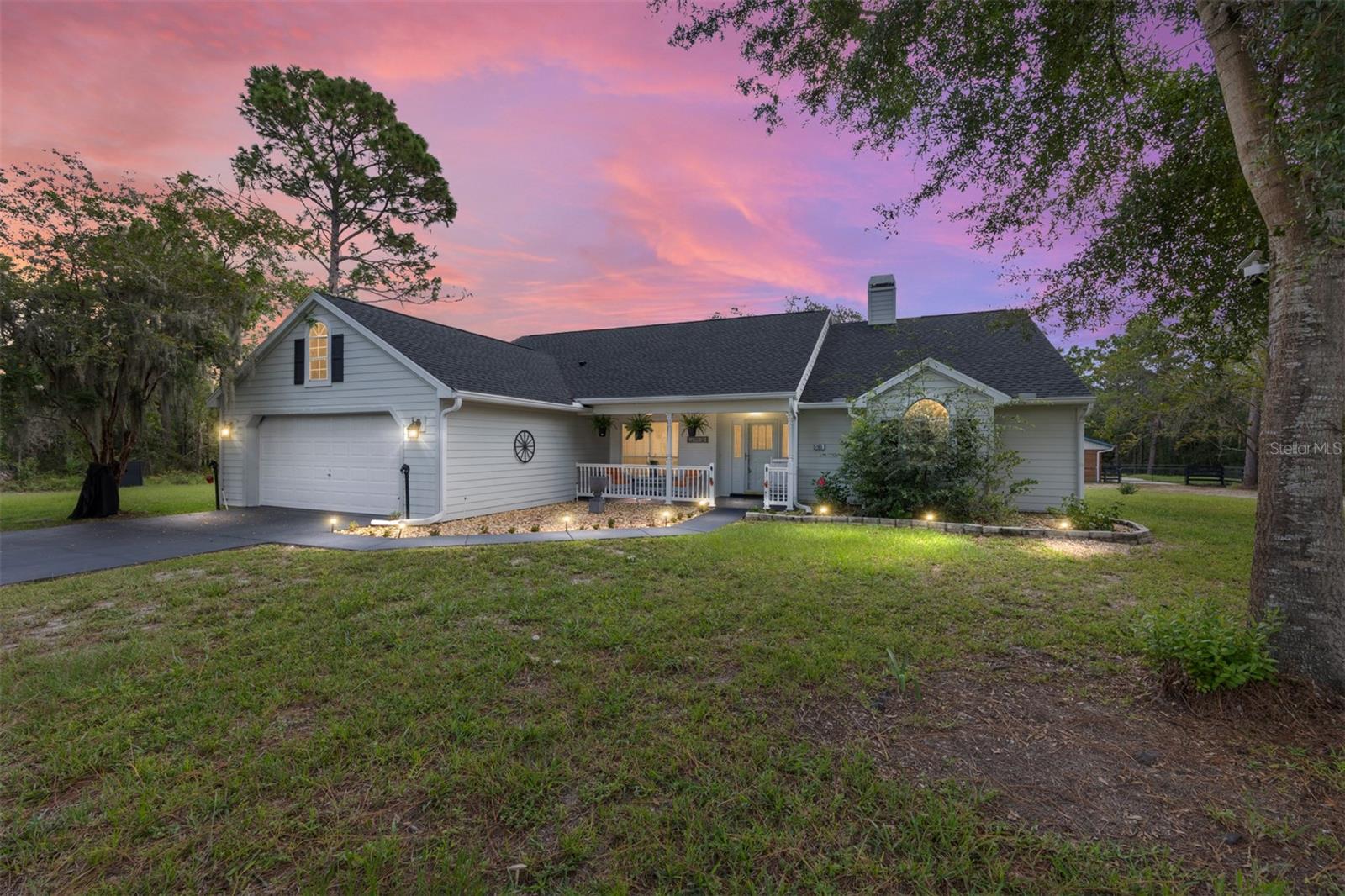 Horse Lover’s Dream on 2.93 Acres! Discover this beautifully maintained 3BR/2BA, 1,968 sq. ft. home on a corner lot in Beverly Hills, FL. Features include a split plan, wood-burning fireplace, granite counters in the kitchen with plenty of cabinets & a breakfast nook, and a spacious primary suite with soaking tub and separate shower. Enjoy seamless indoor-outdoor living with multiple 8' pocket sliders opening to the large lanai (10X31' long) The property is fully fenced with freshly painted four-board fencing (Aug. 2025) and includes a refinished barn with 2 stalls, an open stall, tack room, metal roof with gutters and separate paddocks — perfect for horses or a private mini-farm. Recent updates provide peace of mind with a new roof (Sept. 2021) and AC system (Apr. 2015). Just minutes from shopping, dining, restaurants, and medical facilities. This home offers the perfect balance of peaceful country living and modern convenience. Don't hesitate to make your appointment to view this property before it's gone!