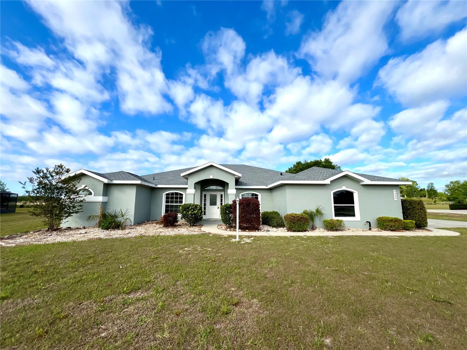 Spacious and beautifully updated, this 4-bedroom, 2-bath home in Belleview’s desirable Golf Park neighborhood offers the perfect blend of comfort, style, and outdoor living. Nestled on a generous 1.93-acre lot, this 2,754 sq ft residence features soaring high ceilings, fresh interior paint, and brand new luxury vinyl flooring throughout the main living areas. The heart of the home is a large living room anchored by a cozy fireplace—ideal for relaxing evenings. The split-bedroom layout ensures privacy, while the open kitchen flows seamlessly into the Florida Room, where you'll find a brand new summer kitchen—perfect for entertaining year-round. Step outside to enjoy the peaceful, park-like setting with plenty of space for outdoor activities, gardening, or future enhancements. Whether you're hosting gatherings or seeking quiet retreat, this home offers the flexibility to fit your lifestyle. Don't miss your opportunity to own this move-in-ready gem in a quiet, established community. Schedule your private showing today!