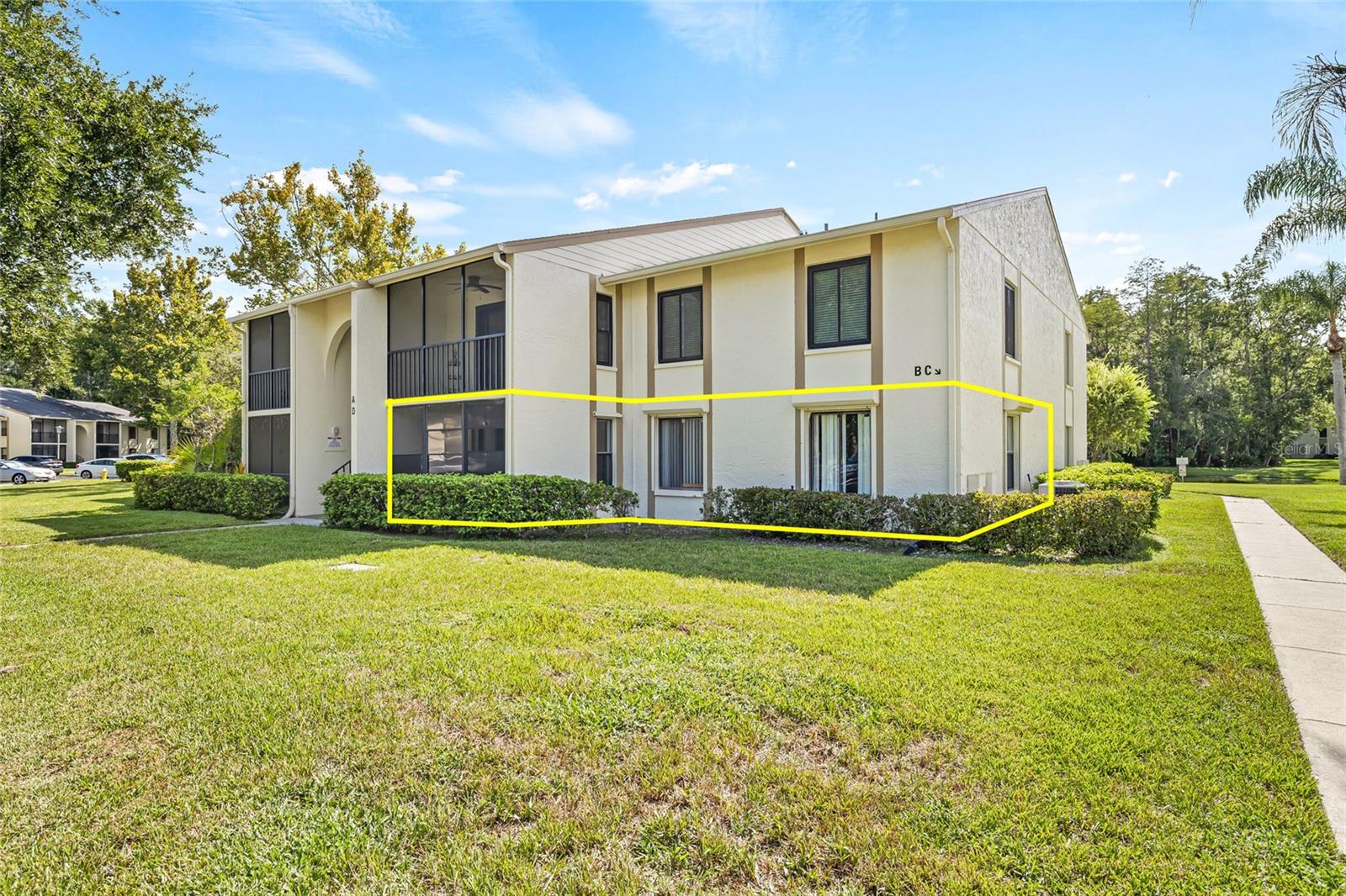 LOCATION, LOCATION! This this 2-bedroom, 2-bathroom CORNER unit on the FIRST floor is spacious, includes laundry room with washer and dryer and has screened-in balcony. The ALL-AGES community of Pine Ridge offers a clubhouse, heated pool and jacuzzi, tennis courts, and assigned parking. Low quarterly condo fees include water, trash, cable, escrow reserves, and exterior maintenance. Enjoy resort-style amenities including a luxury pool and spa, tennis courts, fitness center, and included utilities like water, sewer, trash, cable, and WiFi—all wrapped into your low monthly fee. Located just steps from the scenic Pinellas Trail, you’ll love having outdoor adventure right outside your door. Upon your arrival at the property you will enjoy your own assigned parking spot, along with the community amenities that include a Pool/Spa, Pond with picturesque Water Fountain, BBQ, Playground, Tennis courts, walking paths, and a full community center. Community has matured and well-manicured landscape. This peaceful neighborhood is the perfect location to unwind after a long day at the office, or to work at home and enjoy the views. Walk to highly rated Elementary and High School. This condo is right in the middle of shopping and restaurants, with easy access to East Lake Road, Trail, Chestnut Park at Lake Tarpon & YMCA. A short drive will bring you to the historic Tarpon Springs sponge docks. Howard Park Beach & Sunset Beach. Tampa International Airport & St. Pete Airports are all just 25 min. Schedule a showing Today! Just minutes away, enjoy the charm of Tarpon Springs including the historic Sponge Docks, authentic Greek dining, Fred Howard Park, Anclote Key Preserve, and scenic trails like the Pinellas Trail.