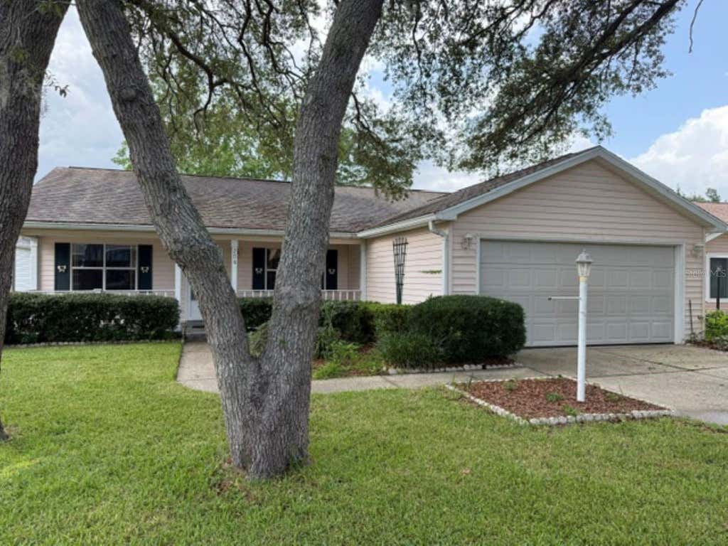 Photo of 208 Aragon Lane, Lady Lake, FL 32159 (MLS # OM728971)