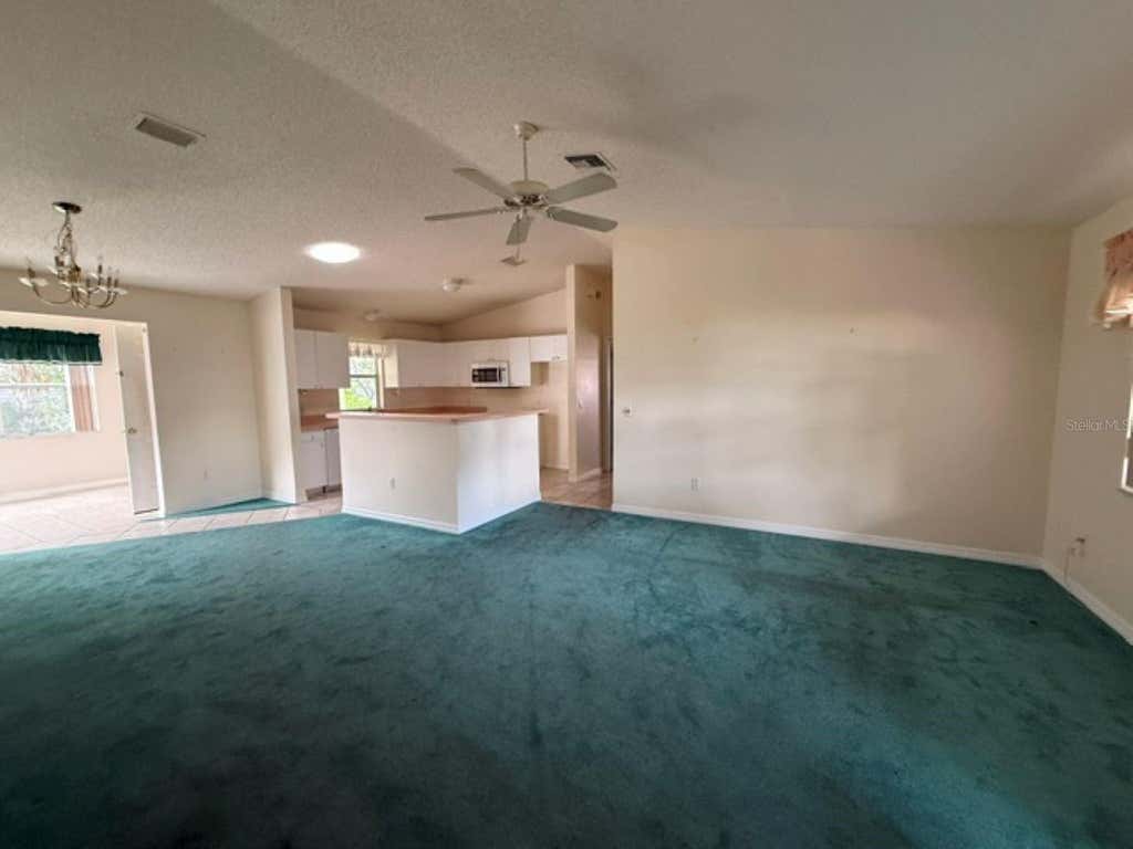 Photo of 208 Aragon Lane, Lady Lake, FL 32159 (MLS # OM728971)