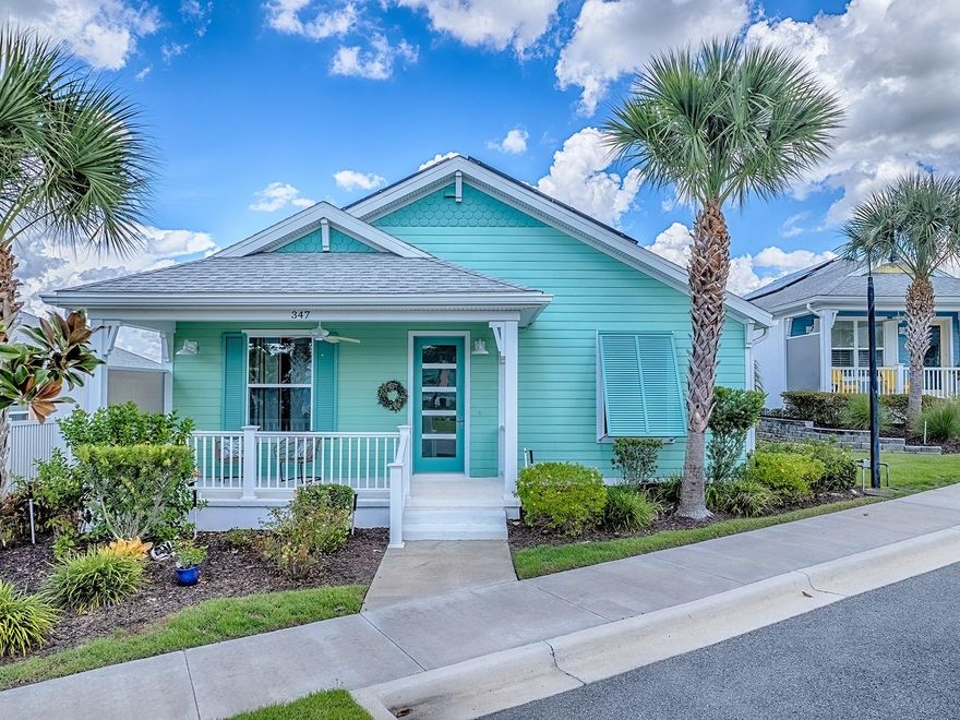 Experience a slice of paradise in Central Florida with a distinctive Key West feel. Imagine a neighborhood that effortlessly combines tranquility with vibrant community life, where every moment feels like you're on Island Time. Going along seamless sidewalks you can relish in social interactions, or engage in the active lifestyle around the community areas.

Experience an inviting elevated front porch, perfect for relaxing right off the neighborhood sidewalk. It's an ideal spot for social interactions and sits directly across from the community area, so the action is always close by. As you enter through the frosted 5-panel front door, natural light greets you warmly, leading you into a welcoming foyer. Your journey begins with the first bedroom to the right and continues into a spacious open living area with a kitchen featuring an eat-at bar, recessed lighting, white shaker-style cabinets, stone countertops, and stainless steel appliances. The living room boasts a plantation-shuttered sliding door, a tray ceiling, and expansive space for entertainment and comfort. Elevated ceilings and 8 ft doors contribute to the luxurious atmosphere.

The primary bedroom is a haven of comfort, featuring a well-appointed space with a double sink vanity, a step-in large open shower, a spacious closet, and the convenience of pocket doors.

The 2-car garage is discreetly located at the back preserves the front view's aesthetic appeal and enhances the home further with its sleek epoxy floor.

Green Key Village is more than just a residence; it's an eco-conscious community inspired by the charm and vibrant colors of Key West. It's a neighborhood that encourages connection, with regular social activities like lunches, pickleball, tennis, and basketball, culminating at the exquisite pool where you are sure to build lasting friendships & offers a maintenance-free tropical retreat. 

Every detail speaks to an island-inspired oasis—embracing quality, craftsmanship, and undeniable value. The Bahama shutters and exquisite curb appeal exude a relaxed yet refined aura. Enjoy energy-efficient living with full solar arrays and smart home technology, reducing or even eliminating electric bills.

Enjoy a new, simple, and smart way of life, surrounded by the warmth and vibrancy of this extraordinary Central Florida haven.