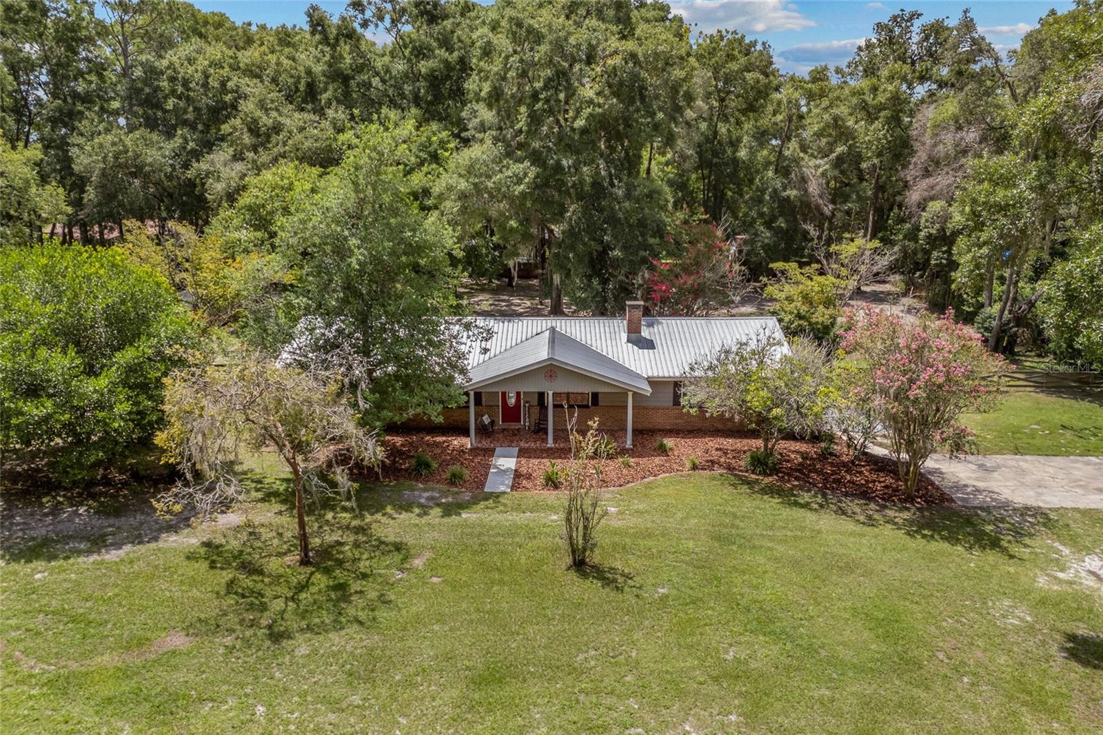 Welcome home to your private retreat on nearly two acres in the highly desirable CR 241 corridor! Nestled at the end of a quiet cul-de-sac, this 4-bedroom, 3-bath home offers the perfect blend of peaceful country living and convenient access to everything you need. Just minutes from Publix, the charming Town of Tioga, and a wide variety of restaurants and shops, you’ll enjoy the best of both worlds—tranquil seclusion with city amenities close at hand.
Inside, the thoughtfully designed floor plan offers flexibility for modern living. With two potential primary bedroom suites and multiple living areas, there’s space for everyone to spread out and relax. Whether you need a private guest suite, a multi-generational layout, or a spacious home office, this home adapts to your needs.
Step outside and take in the beauty of nearly two acres of fenced property, providing ample room for pets, gardening, play areas, or future landscaping projects. With no HOA, you have the freedom to bring your boat, RV, or explore your homesteading dreams without restrictions.
This property is more than just a home—it’s an opportunity to create the lifestyle you’ve always imagined, in a location that balances country charm with everyday convenience.