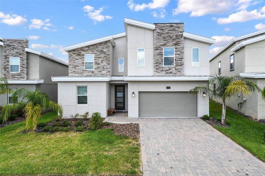 Fabulous vacation home in the prestigious ChampionsGate community! This fully furnished and professionally decorated residence offers 8 bedrooms, 5 bathrooms, and a beautiful pond view. The spacious layout includes a large family room, open dining area, and a modern kitchen—perfect for entertaining. Step outside to a covered lanai with a screened-in pool, heated spa, and plenty of room to relax. The garage has been converted into a fun game room, and the home also features an inside laundry and ample storage. ChampionsGate delivers world-class amenities including a championship golf course, pro shop, movie theater, fitness center, resort-style pool, lazy river, tiki bar, splash park, tennis and volleyball courts, spa services, and a full-service clubhouse with bar and grill. This guard-gated community is just minutes from I-4, offering easy access to Walt Disney World, SeaWorld, Universal Studios, and Orlando’s best shopping and outlets. Don’t miss your chance to own this private piece of paradise!