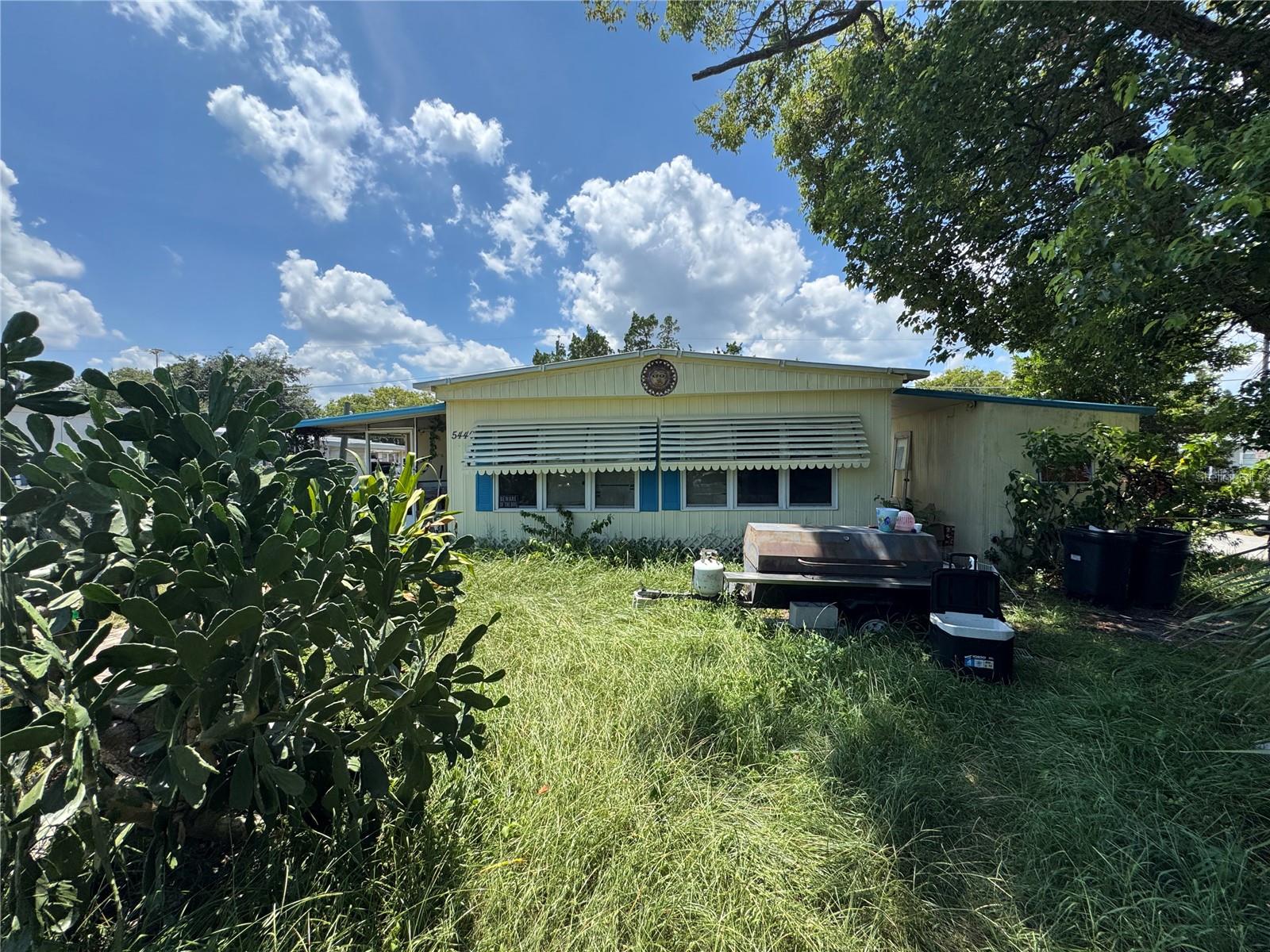 Investor special in Port Orange! Come check out 5440 Pineland Avenue — a 2 bedroom, 2 bathroom mobile home that needs lots of care. This is a great fixer upper for anyone looking to flip it, rent it out, or fix it up to live in. The home has a good layout with space to make it your own. It will need repairs and lots of work, but there's big potential. Located on a quiet street with no HOA. Priced to sell. Come see it for yourself!