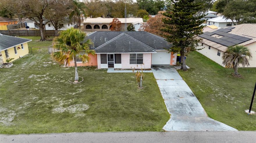 Spacious single-family home featuring a large covered and screened patio, perfect for enjoying Florida outdoor living year-round. This versatile space is ideal for entertaining, relaxing, or creating an outdoor dining area while staying protected from the elements. The backyard offers plenty of room for gatherings, pets, or future landscaping improvements. Conveniently located near major roads, shopping, and everyday amenities. A great opportunity for homeowners or investors looking for comfort and potential.