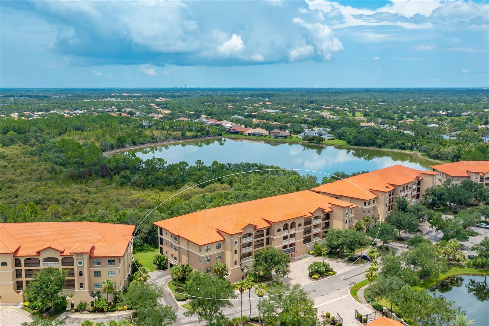 Welcome to Lake Vista Residences, Unit #C403, a beautifully maintained top-floor condo offering serene preserve views from your private, newly re-screened lanai. This 3-bedroom, 2-bathroom residence is located in an upscale, gated community in the heart of Lakewood Ranch, known for its convenience, safety, and resort-style amenities. Enjoy the peace of mind and comfort of impact-resistant windows and doors, key fob building entry, two assigned under-building parking spaces, a private storage unit, and interior mailroom access. The building was recently repainted (2025), and a new roof and A/C air handler & condenser was installed in 2023. Inside, you'll appreciate the thoughtful layout featuring a laundry room, pantry closet, and ample storage throughout. the spacious primary suite is a true retreat, offering access to the lanai, a walk-in closet, and a luxurious en-suite bathroom with dual sinks, a garden soaking tub, walk-in shower, separate water closet, and comfort-height toilets (2025). Custom blinds adorn the lanai triple sliders and primary suite doors, with ceiling fans and window blinds throughout the home. Recent updates and improvements include water heater with UV light (2023) Glass shower wall in master bath (2024). Building/patio repaint, new garbage disposal, porch light/fan, washing machine, interior paint, cleaned air ducts (2025). Community amenities include a heated pool, hot tub, fitness center, clubhouse with full kitchen, grilling area, and on-site management. Lake Vista has no CDD fees! Located just 1 mile from Lakewood Ranch Main Street and Medical Center, 2.5 miles to University Town Center Mall and Mote Aquarium, 7 miles to Sarasota-Bradenton Airport, and 14 miles to St. Armands Circle. You're never far from the area's best dining, shopping, healthcare, and entertainment. There is a transferrable Home Warranty in place through 3/2026.
