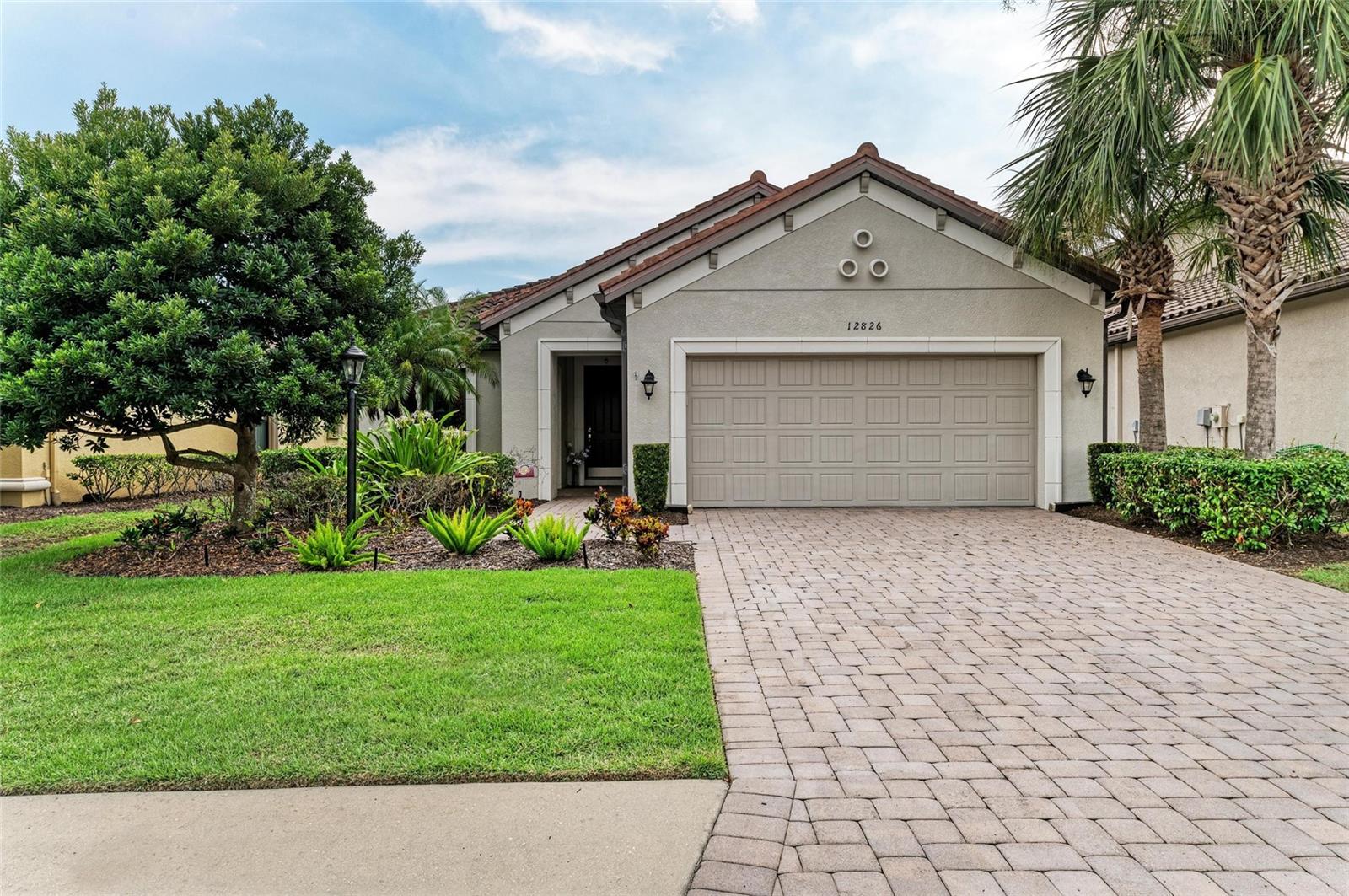 Live the Florida lifestyle you’ve been dreaming of in this beautifully upgraded 2-bedroom, 2.5-bath home with a dedicated study/office and an attached 2-car garage. Tucked inside the exclusive, gated Esplanade at Lakewood Ranch, this home offers all the perks of resort-style living—luxurious amenities, upscale dining, and private community events—with no golf membership required. No detail has been overlooked—with over $32,000 of upgrades and additions, this home showcases a gourmet kitchen with a center island, Cambria quartz countertops, custom-tiled backsplash, refaced cabinetry with designer hardware, stainless steel appliances, a stylish new sink, upgraded lighting, fresh interior paint, and new Luxury Vinyl Plank flooring that flows throughout the main living spaces and office. The open-concept floorplan highlights a serene Owner’s suite with bay windows framing tranquil preserve views, an en-suite bath featuring dual vanities, a walk-in shower, private water closet, and large walk-in closet. A private guest suite is located on the opposite side of the home and includes a full bath with granite vanity and designer tile tub/shower combo.
Additional highlights include a large laundry room with ample counter space and storage, a chic guest powder room, and an attached garage with epoxy flooring. Step outside to your private, screened lanai and enjoy peaceful sunset views and the beauty of surrounding nature. Living in Esplanade of Lakewood Ranch means access to this maintenance-free, premier gated, resort-style community packed with top-tier amenities including: Tennis and pickleball courts, Resort pool and spa, Second pool area, State-of-the-art fitness center with personal training, Fine and casual dining options, including a formal restaurant and Tiki bar, Full-service spa and salon, Social activities, walking trails, and more. Just minutes from top-rated schools including Lakewood Ranch Preparatory Academy, world-class golf courses, dining, shopping, University Town Center, & a short drive to the white-sand beaches, downtown Sarasota, & I-75 for quick access to Tampa, St. Petersburg, & beyond. This gated, maintenance-free, amenity-rich community offers a rare opportunity to enjoy luxury living in the nation’s #1 top master-planned community. Whether you’re seeking refined design, modern upgrades, or the perfect Florida lifestyle, 12826 Del Corso Loop truly has it all.