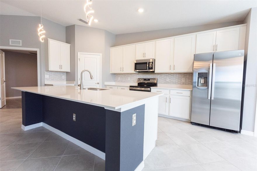 This Dangelo Veranda at Heritage Landing Golf & Country Club is a must-see! Lightly lived in and meticulously
maintained, this stunning 2-bedroom plus den, 2-bath home features breathtaking views of the water and nature preserve—the perfect
setting to enjoy Florida’s colorful sunsets and daily wildlife show from your private screened lanai.
With a social membership included, you’ll enjoy access to resort-style amenities including a tropical lagoon pool, full-service tiki bar,
fitness center, tennis, pickleball, bocce, day spa, and so much more. It’s the ultimate maintenance-free lifestyle in one of Punta
Gorda’s newest luxury gated communities.
Inside, you’ll find upgraded finishes throughout, including top-rated stainless steel appliances, stylish French doors at the den, modern
light fixtures. Enjoy an open-concept layout, attached garage, and two screened
lanais for indoor-outdoor living.