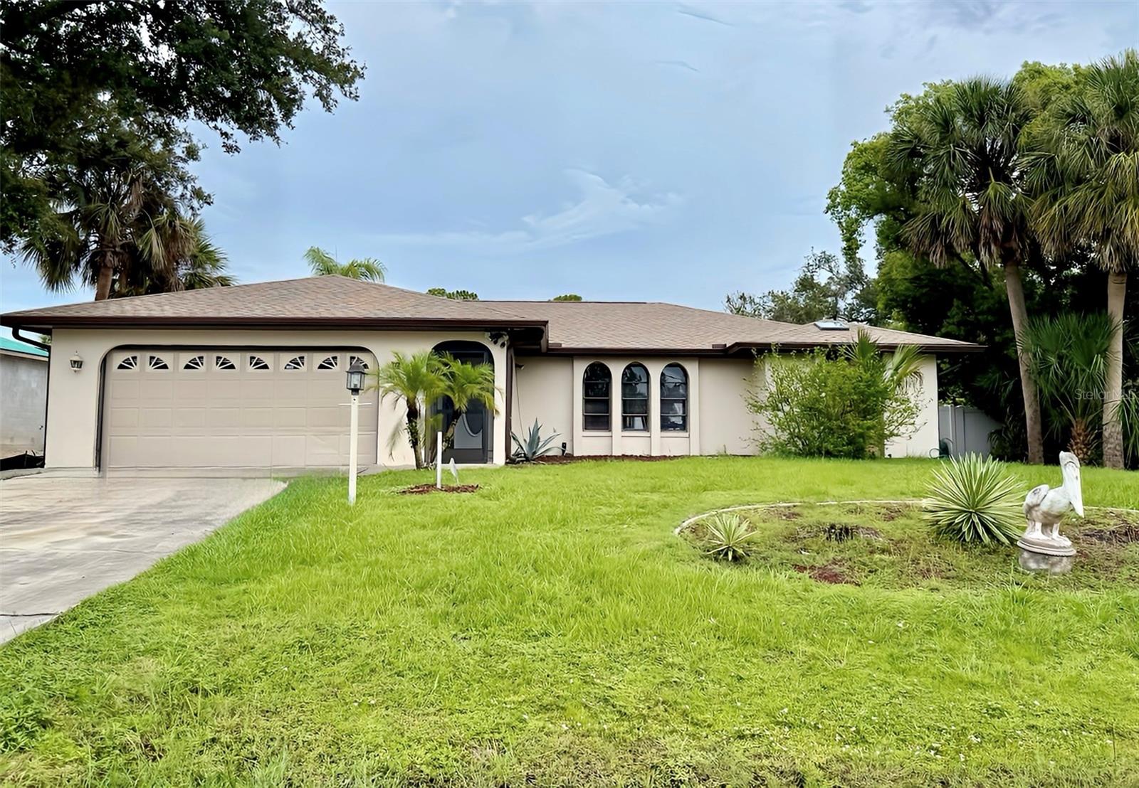 Under contract-accepting backup offers. Enjoy Florida living at its finest! Incredible turn-key opportunity for investors or homeowners. This fully renovated and furnished 3-bedroom, 2-bath pool home features a brand-new roof with new skylights, new gutters, laminate flooring, brand new kitchen cabinets with quartz countertops and stylish backsplash, and all-new appliances including washer, dryer, refrigerator, dishwasher, stove, and microwave. Both bathrooms have been beautifully updated with new vanities and elegant tile. Fresh interior and exterior paint, along with a resurfaced pool, complete this move-in-ready gem. The functional split floor plan offers enhanced privacy, with a spacious kitchen perfect for entertaining and generously sized bathrooms for added comfort. Step outside into your personal oasis through one of the four sliding doors — a large saltwater pool surrounded by an oversized patio area, all within a screened-in pool cage ideal for relaxing or hosting guests. The fully enclosed backyard with vinyl fencing ensures privacy and security, making it perfect for families and pets. Conveniently located in the heart of North Port, close to shopping, dining, schools, and Gulf beaches, this property is a rare find that blends comfort, style, and investment potential.No HOA or CDD fees, No flood zone! PUBLIC WATER. Furniture is available for purchase. Schedule your private showing today!
