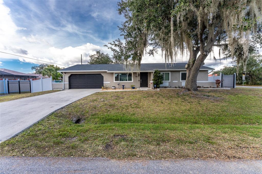 Photo of 824 Calvert Avenue NW, Port Charlotte, FL 33948 (MLS # C7518414)