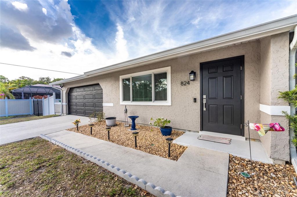 Photo of 824 Calvert Avenue NW, Port Charlotte, FL 33948 (MLS # C7518414)