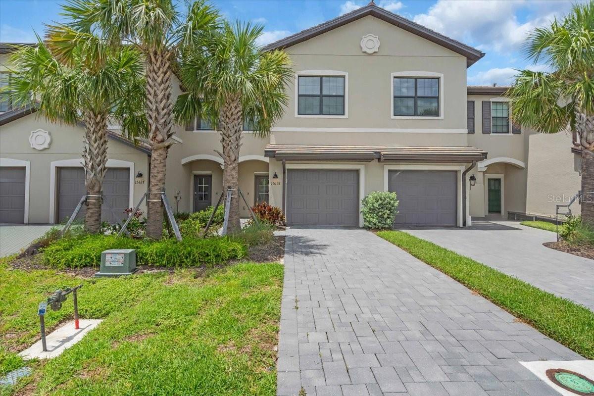 Welcome to this beautifully designed townhome Located in the highly sought-after Lorraine Lakes community. This fantastic, gated community with resort style amenities makes coming home feel like a vacation. Lakewood Ranch is recognized as the number one selling master planned community, and Lorraine Lakes helps set the standards to make that recognition possible. The HOA benefits include lawn maintenance, irrigation, cable, internet, 3 entrances, many common areas, gate guard, and 24-hour security. The amazing resort style town center features amenities including a full-service restaurant, tiki bar, arcade, gym, fitness center, saunas, pickle ball, tennis, volleyball, resort pool, lap pool, and splash pad to name a few. Lorraine Lakes flourishes with walking paths and lovely lakes including the main pond with dock, and fishing is permitted. As you step inside you’ll notice the open-concept layout that seamlessly blends the kitchen, living, and dining areas—ideal for entertaining or casual family living. The main living areas feature neutral ceramic tile flooring, the kitchen comes fully equipped with stainless steel appliances, a gas stove, granite countertops, and 36” upper cabinets providing ample storage. Enjoy casual seating at the kitchen counter and an elegant, dedicated dining area perfect for family meals or gatherings. Enjoy additional designer lighting upgrades that add a stylish touch throughout the home. Step outside to your covered and screened lanai and take in the serene water views—a perfect setting for morning coffee or evening relaxation. Upstairs, the spacious owner’s suite offers a luxurious ensuite bath featuring dual vanities, a walk-in shower, and a generous walk-in closet with custom closet organizer. Two additional bedrooms share a well-appointed full bath, making them ideal for guests or family. It is important to consider the energy efficiency of this south-facing home keeping your utility bills lower and comfort levels higher. Fantastic opportunity to own this gorgeous townhome located in the heart of Lakewood Ranch conveniently located to shopping, restaurants, A-rated schools, championship golf courses and a short drive to the famous beaches of the gulf coast.