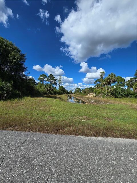 Photo of 419 Wilder Avenue S, Lehigh Acres, FL 33974 (MLS # O6354278)