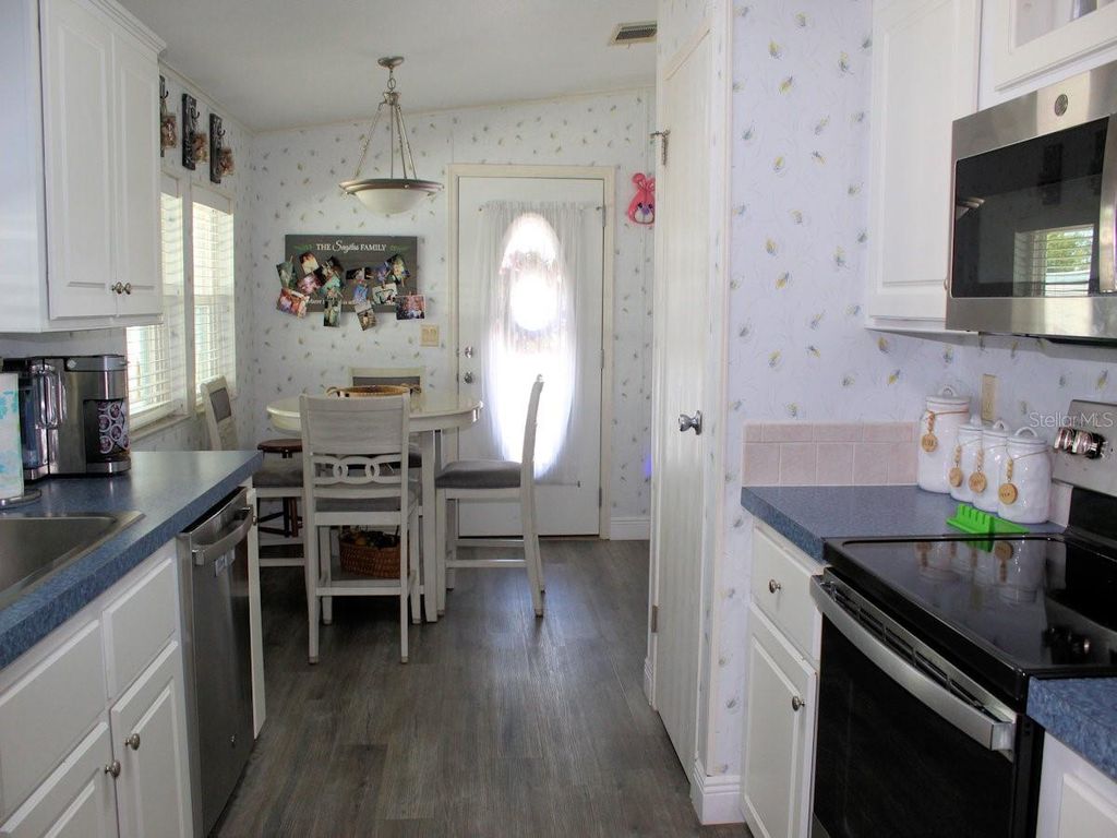 Photo of 64 Thatch Palm Street W, Largo, FL 33770 (MLS # TB8497397)