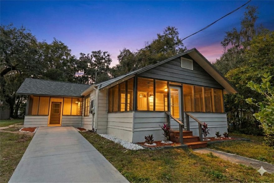 Beautifully appointed Dade City home on a cobblestone street, on a nearly quarter acre lot (24,000 sqft lot,) 3 (three) full baths, a office/guest room area, and featuring a natural shrub fence line. This home is done top to bottom. Upon entry, you will find an open format home with plenty of natural light, featuring a spacious living/dining area. To the right side of the home, you will find two very spacious bedrooms, and a large hallway bath, fully updated with tile throughout, vanity, private commode (behind the door), and fixtures.  Out past the bedrooms and into the kitchen - the kitchen features updated cabinetry throughout, as well as quartz, and NEW stainless appliances.  Past the kitchen, you will step into the office/guest room area, which features its own updated full bath - updated with tile throughout, vanity, commode and fixtures.  To the left of the office/guest area, you will find the expansive ensuite master bedroom - which features a walk-in closet, a very spacious bedroom area, as well as ensuite bathroom, also featuring updated tile throughout, vanity, commode and fixtures.  This home has an updated AC and water heater, and will have a new roof installed prior to closing.  With the huge lot, you can enjoy with family in those cool Dade City nights, and you are minutes from the action of downtown Dade City and its excellent restaurants.  Located close to Tampa and Zephyrhills, this is the perfect property for an easy commute to larger cities! Come see this home today!