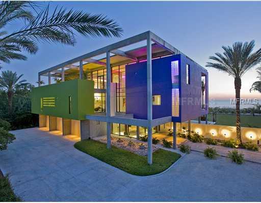 A VERY PRIVATE BEACHFRONT ESTATE: securely positioned behind the 24/7 guard gates in prestigious Sanderling Club, this stunning Architectural award-winner is jaw-droppingly gorgeous. Exciting 36' ceilinged ground level foyer welcomes guests in a gracious way. The home lives and entertains with style and comfort. Fabulous deep covered terraces on three levels offer opportunities for elegant outdoor living providing precious shade with a constant soft sea breeze to cool. Grand-sized common area rooms with sunset and Gulf views from every one of them offer both formal living and dining room and casual family room open to kitchen. Sensational master suite with his and her baths and dressing areas features its' own private Gulf-view terrace and a roof garden for morning coffee and serenity. Family wing is separate and each room is en suite. Guest quarters are very privately situated. Gulf-view gym. Resort-caliber grounds (1.53 acres) feature stunning specimen trees, manicured gardens, lap-length swimming pool and large spa. A volley ball court, fire pit and spectacular fountain complete the picture, accented by verdant lawns leading to a true walking beach, unusual for its almost total privacy. A very private dock on Heron Lagoon is ideal for kayaking, fishing and bird-watching. This residence is built in the same manner as a condominium from the 100 + 40' deep pilings to the reinforced concrete roof of the structure. The home features an oversized 3 stop elevator and a 4+ car garage.