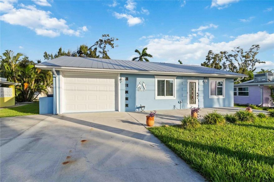 Come see this charming coastal retreat on a colorful Bay-view street near Cortez! This 2-bedroom, 2-bath home offers the perfect blend of comfort, style, and location—just a few short miles from the beach.

Step inside to find tile floors throughout, a newly renovated kitchen, and two fresh, modern bathrooms. The kitchen shines with 42-inch soft-close shaker cabinets, quartz countertops, and plenty of workspace for cooking or entertaining. Both bathrooms feature step-in showers, shaker cabinetry, quartz counters, and ample storage.

With a living room plus a family room, all painted in breezy coastal colors, there’s space to relax and spread out. From several spots in the home—and especially from the large front and rear patios—you’ll enjoy peek-a-boo views of Sarasota Bay. Picture yourself sipping an evening cocktail on the front patio while the sun sets, or strolling down Bayview Drive to take in the sights over Sarasota Bay and Longboat Pass.

Practical updates make this home move-in ready: double-paned impact windows, plantation blinds, ceiling fans, and an HVAC system and water Heater replaced in summer 2025. The metal roof (2012) provides long-lasting durability. An interior laundry and storage room, plus a spacious shed with electricity (contents included), add everyday convenience.
Less then 2 miles from the sandy beaches of Anna Maria Island, beat the traffic or ride your bike! 

Whether you’re looking for a winter getaway, a full-time residence, or an investment property, this home offers it all—steps from the bay and minutes to the beach. Don’t miss this charming retreat!