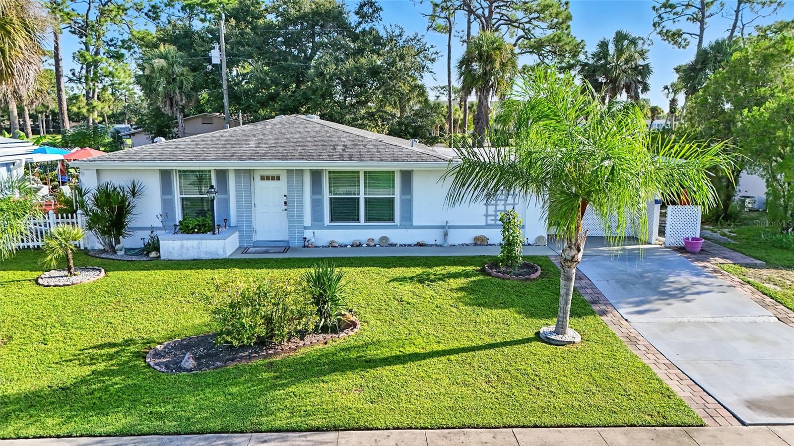 This charming 2-bedroom, 1-1/2 bath home has been lovingly maintained and is truly move-in ready. The home offers a perfect blend of comfort and functionality, making it ideal as a starter home, seasonal retreat, or income-producing rental property. Inside you’ll find granite countertops, hurricane IMPACT windows, easy-to-maintain tile and terrazzo flooring, and an enclosed patio that provides flexible bonus living space. A newer AC and energy-efficient tankless water heater add to the home’s value, while the fully fenced backyard with two storage sheds gives you plenty of room for outdoor enjoyment. The location is unbeatable—just minutes from shopping, dining, the Atlanta Braves Spring Training Stadium, Warm Mineral Springs, and only a short drive to the Gulf Coast’s beautiful beaches. Don’t miss this opportunity to own a well-cared-for North Port home in a prime location—schedule your private showing today!