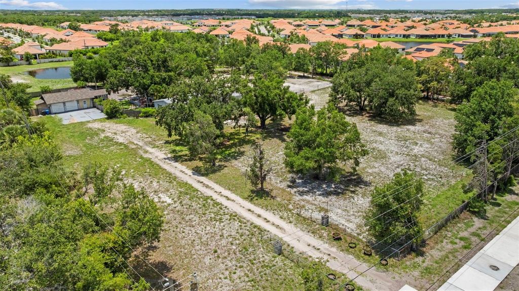 Photo of 2221 W Lake Drive, Wimauma, FL 33598 (MLS # TB8400121)