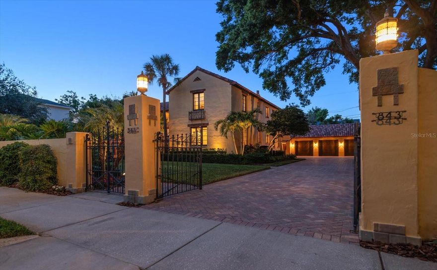 One or more photo(s) has been virtually staged. Step into a piece of St. Petersburg history with this enchanting 1925 Spanish/Mediterranean-style estate, nestled in the highly desirable Crescent Lake neighborhood. Situated on 2½ expansive lots and offering 5,320 square feet of beautifully restored and thoughtfully updated living space, this elegant residence includes a grand main home, guest quarters, a spacious three-car garage, and a lush private pool retreat—all tucked behind a beautifully crafted privacy wall.
Built during the same golden era as the iconic Vinoy Hotel, this architectural masterpiece features a Spanish tile roof, wrought iron balconies, Mayan tile accents, and extensive pecky cypress ceilings and beams. Manicured landscaping, a peaceful courtyard with a Mayan-tiled fountain, and a shaded veranda set the stage for what awaits inside. Every inch of this home reflects the craftsmanship and style of its time—arched doorways, refinished original wood doors, antique hardware, mosaic tile, and period-specific lighting preserve the elegance of the 1920s while seamlessly blending with modern conveniences.
A meticulous renovation in 2008 brought the home into the 21st century without compromising its original soul. Upgrades include new plumbing and wiring, Pella impact windows, and a chef’s kitchen with high-end appliances, custom wood cabinetry, butcher block island, hammered copper sink, and Egyptian marble countertops. Ideal for entertaining, the main living areas flow effortlessly from room to room and open to the private, tranquil courtyard and pool area. The main floor consists of formal dining room, kitchen, informal breakfast room, library, a spacious bedroom with en suite bath and two 1/2 baths.
Upstairs, the luxurious primary suite offers a peaceful escape with a pecky cypress and tile balcony, a spa-like bath with dual copper sinks, soaking tub, oversized shower with rain head and body jets, and a custom dressing room with granite island and extensive storage. Two additional upstairs suites provide private comfort for family or guests.
The detached guest quarters, just steps from the pool and main house, offer two private entrances and include a bedroom, living space, and full bath—all under air-making it ideal for guests or office space. The oversized three-car garage is equipped with hurricane-rated doors, and openers with direct access to the main home via the utility entry. 
Surrounded by flowering gardens, swaying palms, and glowing landscape lighting, the backyard is a true tropical escape. The heated pool, brick paver patio, and outdoor dining areas create the perfect setting for both relaxation and entertaining. This home feels truly enchanting and magical! 
Located just two blocks from Crescent Lake Park and minutes to downtown St. Pete’s shops, restaurants, and waterfront attractions, this home combines the best of historic charm and luxurious modern living—without the need for flood insurance.