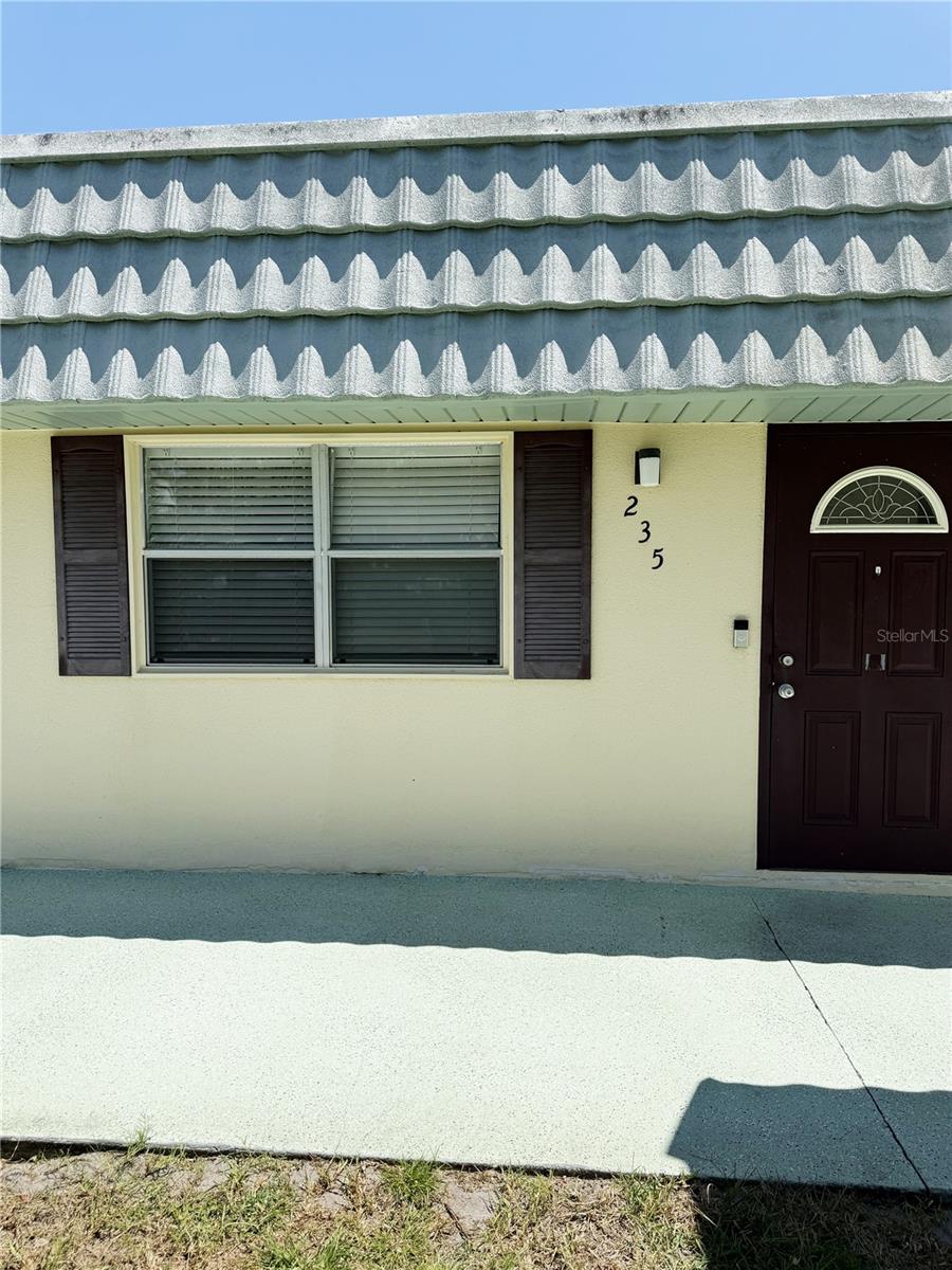 SELLER WILL CARRY THE NOTE FOR UP TO 10 YEARS WITH $25,000 DOWN. One of the lowest priced condos, with probably the lowest condo fees, $565.80 per month, in all of Kings Point. And it's beautifully updated and move-in ready. CLOSE QUICK! This charming 1-bedroom, 1.5-bath condo in fabulous Kings Point features a thoughtfully designed layout with luxury vinyl plank flooring throughout and a gorgeous kitchen. This is low-maintenance living in a vibrant, resort-style setting. The large bedroom with wall-to-wall closets leads to a lanai with a rear entrance only steps from your covered parking space. The additional half bath is perfect for guests. The Bedford J HOA will gladly accept certified service & emotional support animals. Whether you're ready to retire or seeking a seasonal getaway, this is a rare opportunity to own in one of Tampa Bay’s premier active adult communities. Don’t wait—bring your offers today! Kings Points world-class amenities are remarkable, and the condo fees include high-speed Internet, premium cable, grounds maintenance, roof, building exterior, building insurance, pest control & water, sewer, trash. Taxes are low as well. A resort-style, active retirement community, gated, with two beautiful clubhouses, 6 heated pools, an 850-seat theater, an elegant spa, tennis courts, 3 golf courses, 2 hot tubs, billiards, several pickleball courts, two state-of-the-art fitness centers, and much, much more. Dozens of social and sports clubs will keep you entertained year-round. This maintenance-free community allows access to doctors, hospitals, shopping, banking, restaurants, and virtually everything you will ever need via golf cart. Kings Point even has its own free transportation system. Centrally located minutes from an assortment of Florida's best beaches, Tampa's convenient cruise port, and Disney World, Kings Point is an award-winning community and one of Florida's best places to live!