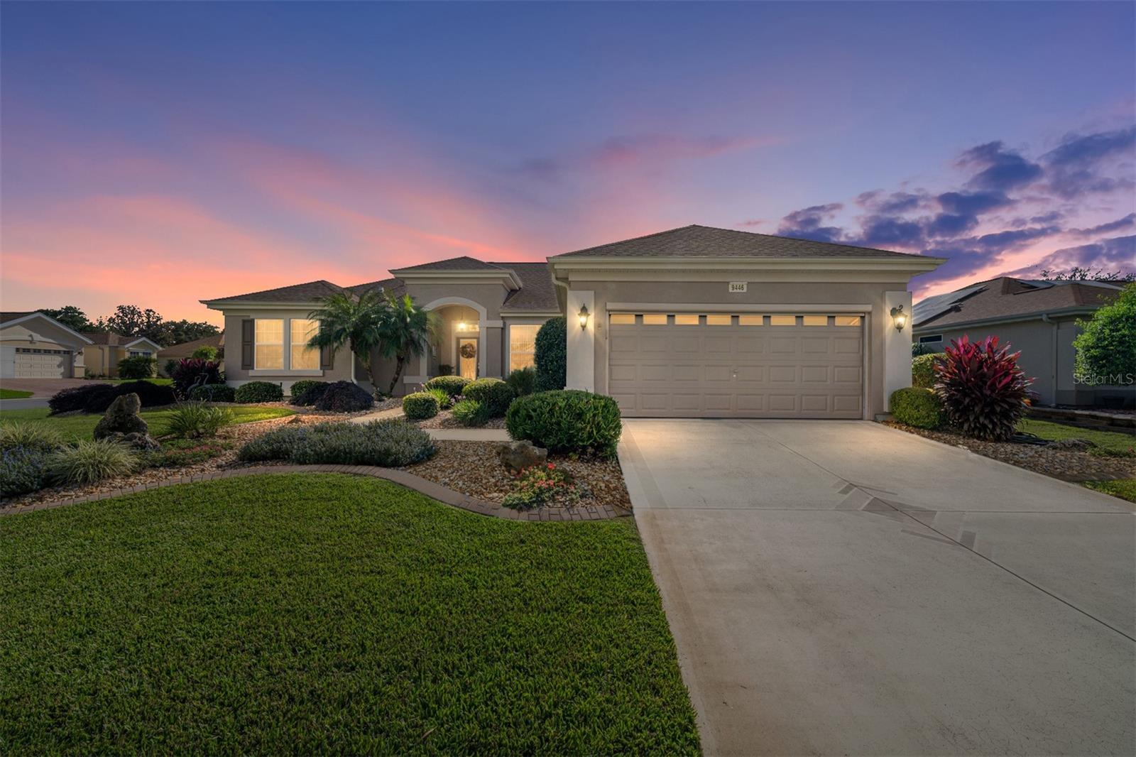 IMMACULATE ST. GEORGE MODEL – SHOWS LIKE A DESIGNER HOME!
This immaculate 2-bedroom, 2-bath St. George model sits proudly on a beautifully landscaped corner lot and shows like a model home. Step through the leaded glass front door and you’ll immediately notice the care and upgrades throughout — with ceramic tile and laminate flooring only (NO carpet anywhere!).The kitchen is a standout with its Corian countertops, tiled backsplash, white cabinetry, newer white appliances including a gas range, upgraded sink, skylights, recipe windows, and a convenient breakfast bar. Crown molding graces every room, adding a touch of elegance throughout. Perfect for entertaining, the kitchen overlooks the family room so you’re always part of the conversation. The living and dining rooms feature recessed lighting, laminate floors, and vertical blinds, creating a bright and welcoming space. The spacious primary suite includes laminate flooring, crown molding, and mini-shade window treatments. The ensuite bath features a raised double vanity with granite countertops, plus both a water closet and linen closet. The guest bath has also been tastefully updated with a raised vanity and granite counter. The laundry room, located just off the kitchen, offers extra cabinetry for storage and doubles as a butler’s pantry. The extended garage includes pull-down attic stairs, a privacy screen, windows in the garage door, and an epoxy-coated floor. Relax year-round in the enclosed lanai — cooled and heated for comfort — with a painted floor and roller shades. Just outside, enjoy your private 10x12 patio, perfect for grilling or morning coffee. Recent updates include a new roof (2022) and HVAC system (2019). This home truly has it all — pristine condition, smart updates, and exceptional attention to detail. Don’t miss seeing it today!