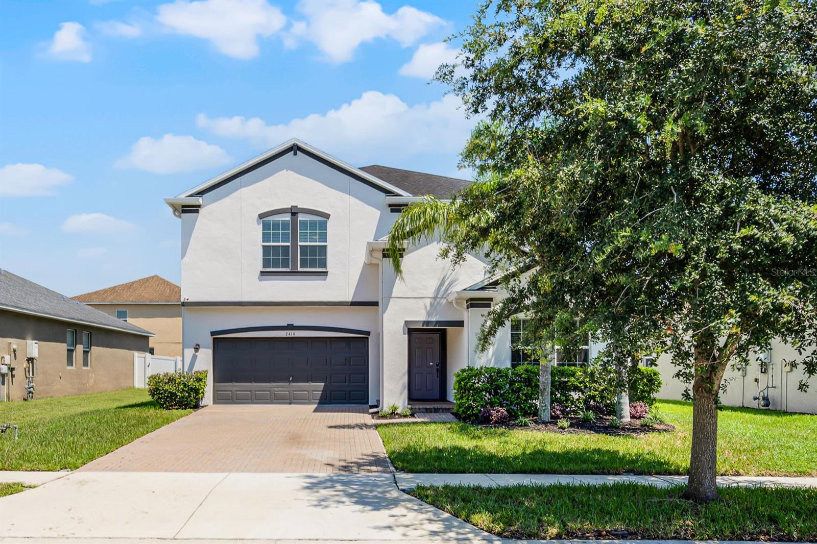Discover the perfect blend of comfort, style, and space in this beautifully designed two-story home located in the highly desirable Enclave at Terra Bella in Land O Lakes. Built in 2017, this spacious 5-bedroom, 3-bathroom residence offers over 3,200 square feet of elegant living space crafted for both entertaining and everyday life.
The first floor welcomes you with an open-concept living and dining area, a private home office, and a full guest suite—perfect for visitors or multi-generational living. The gourmet kitchen is the heart of the home, featuring sleek solid surface countertops, stainless steel appliances, a walk-in pantry, and a bright breakfast nook overlooking the screened-in patio.
Upstairs, a generous loft provides the perfect flex space for a media room, game area, or relaxation zone. The luxurious primary suite boasts a large walk-in closet and spa-inspired ensuite with dual vanities. You’ll also love the convenience of an upstairs laundry room and the abundant storage throughout. The 3-car tandem garage features an epoxy floor, and the professionally landscaped yard includes an irrigation system.
Situated on a quiet, sidewalk-lined street with a west-facing lot, this home is in Flood Zone X—no flood insurance required. The home has been freshly painted inside and out and features brand new carpeting in all upstairs areas and bedrooms. Enjoy resort-style living with access to a community pool, plus a prime location just minutes from FL-56, FL-54, and I-75. You're also close to shopping, dining, and entertainment options, making everyday convenience part of the lifestyle. This exceptional home offers the comfort and flexibility you’ve been dreaming of—don’t wait to make it yours!