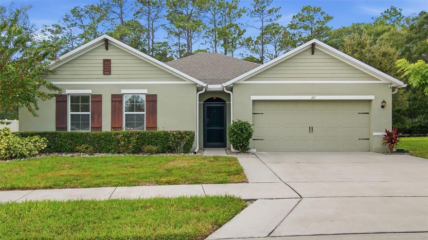 Welcome to 317 Nowell Loop in the desirable Huntington Downs community of Deland. This beautifully maintained, move-in-ready home offers the perfect blend of privacy, convenience, and comfort. The location is ideal—tucked just off Orange Camp Road near Victoria Park, shopping, restaurants, and with easy access to I-4 and award-winning Downtown Deland.

Inside, you’ll find an open and spacious split-bedroom floor plan designed for both functionality and flow. The living, dining, and kitchen areas connect seamlessly, providing plenty of room for entertaining or relaxing at home. The kitchen features granite countertops, solid wood cabinetry, stainless steel appliances, and a generous pantry—offering both style and practicality for everyday living.

The primary suite is a true retreat, featuring a large walk-in closet, a private bath with double sinks, and a comfortable layout that feels tucked away from the rest of the home. The split-plan design provides privacy for family and guests, with additional bedrooms offering ample storage and flexibility for an office, guest space, or hobbies.

One of the standout features of this home is the expansive screened lanai overlooking a peaceful backyard framed by mature trees and green space. Partially covered under truss, this oversized outdoor area is perfect for entertaining, outdoor dining, or simply enjoying the quiet and privacy of your own backyard sanctuary. Whether you’re hosting a gathering or savoring a quiet evening outdoors, this space adds tremendous value to the home’s livability.

Additional highlights include a two-car garage, generous closet space throughout, and an oversized lot that creates a comfortable balance between space and low-maintenance living. Homes in Huntington Downs with this combination of privacy, location, and layout are rarely available and tend to move quickly. Don’t miss your chance to make this exceptional DeLand property your next home—schedule your showing today.