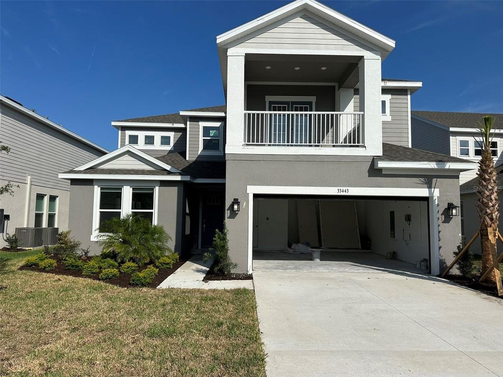 Photo of 33443 Landsman Loop, Wesley Chapel, FL 33543 (MLS # J977451)