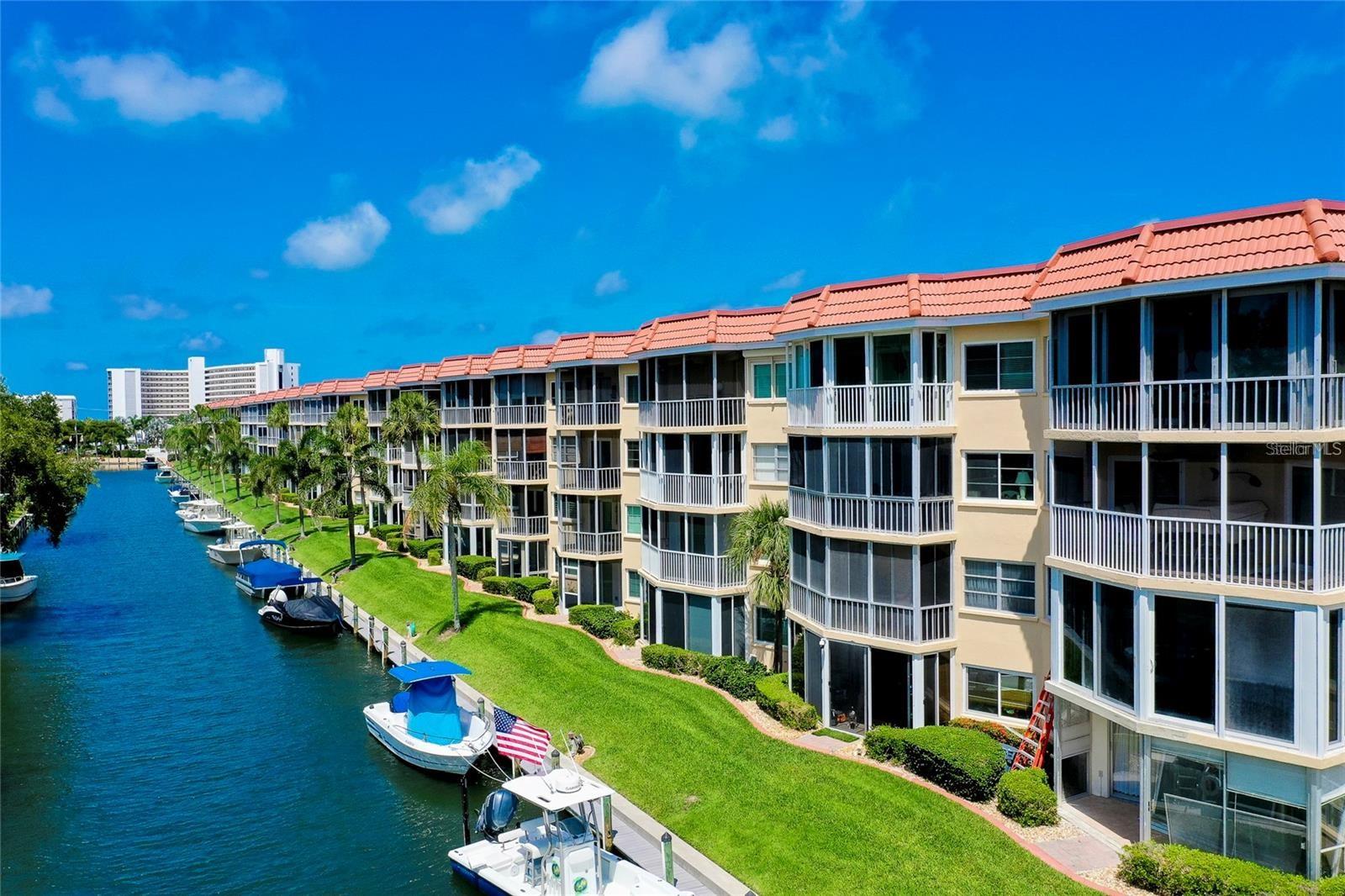 Discover the ultimate Florida lifestyle in this stunning, completely remodeled 2-bedroom, 2-bath condo, located within an active 55+ waterfront community. Beautifully appointed and offered fully furnished, this home provides immediate comfort and upscale relaxation. The spacious screened-in porch offers serene canal views directly leading to the Gulf—perfect for enjoying breathtaking sunsets or morning coffee. Boating enthusiasts will appreciate the convenience of community boat slips available on a first-come, first-served basis. Dock space is available for rent but is not deeded.
Additional amenities include deeded beach access, ensuring the white sands and turquoise waters of the Gulf are always accessible. This vibrant community offers relaxation-style living featuring a heated pool, relaxing spa, fitness center, clubhouse kitchen, library, shuffleboard courts, outdoor grills, locker rooms, and a convenient vehicle washing station. The complex features an on-site property manager in the office who oversees day-to-day operations. With covered carport parking for your vehicle, guest parking available, and a separate storage unit included on the 2nd floor, this condo truly meets all your needs. Laundry facilities are conveniently located on each floor and are free of charge. Perfectly located for buyers seeking a low-maintenance, active coastal lifestyle in an exclusive community. This residence is move-in ready and ideal as a permanent home, seasonal retreat, or investment property. This condo also represents a fantastic investment opportunity with strong rental potential in a highly desirable area. All buildings will have brand-new roofs installed during 2024-2025. Don't miss your opportunity to own this exceptional piece of Florida paradise! Conveniently located near the south end of Siesta Key and Stickney Point Bridge, this property provides quick access on and off the key, connecting you effortlessly to US-41, I-75, shopping, restaurants, and all the amenities Sarasota has to offer.