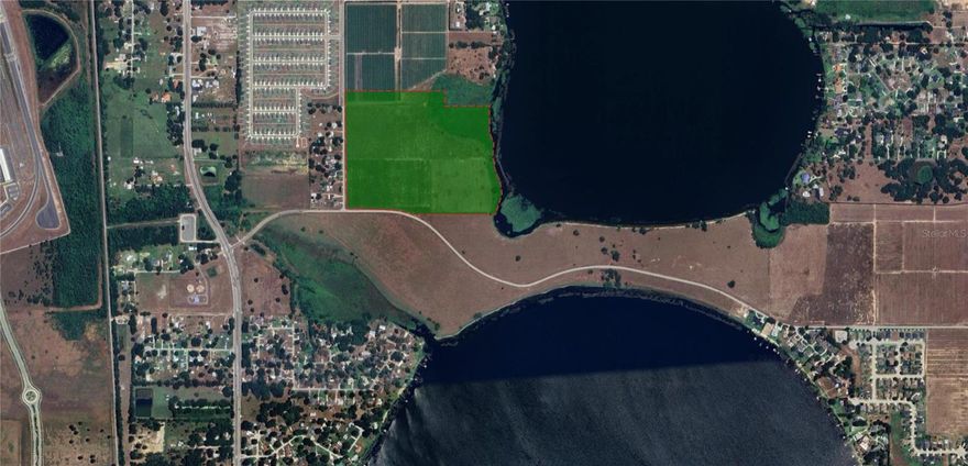 Juliana West Village is a 64-acre assemblage with approved Residential zoning located in the city of Auburndale, Florida. The property is situated on the southwest corner of Lake Juliana, and has about 1500 feet of lake frontage on Lake Juliana. The property’s location is just south of Interstate-4. It’s flanked to the west by the Polk Parkway and County Road 559 to the east. It is conveniently located near Florida Polytechnic University and the DOT SunTrax testing facility. This property sits in an overlay zoning district, called the “Lakes District”, and the specific zoning for this assemblage is Residential Neighborhood which allows for 6 Dwelling Units an Acre. In addition, the Lakes District allows for the transfer of densities from one parcel to another. There are 4 total parcels included in this assemblage.