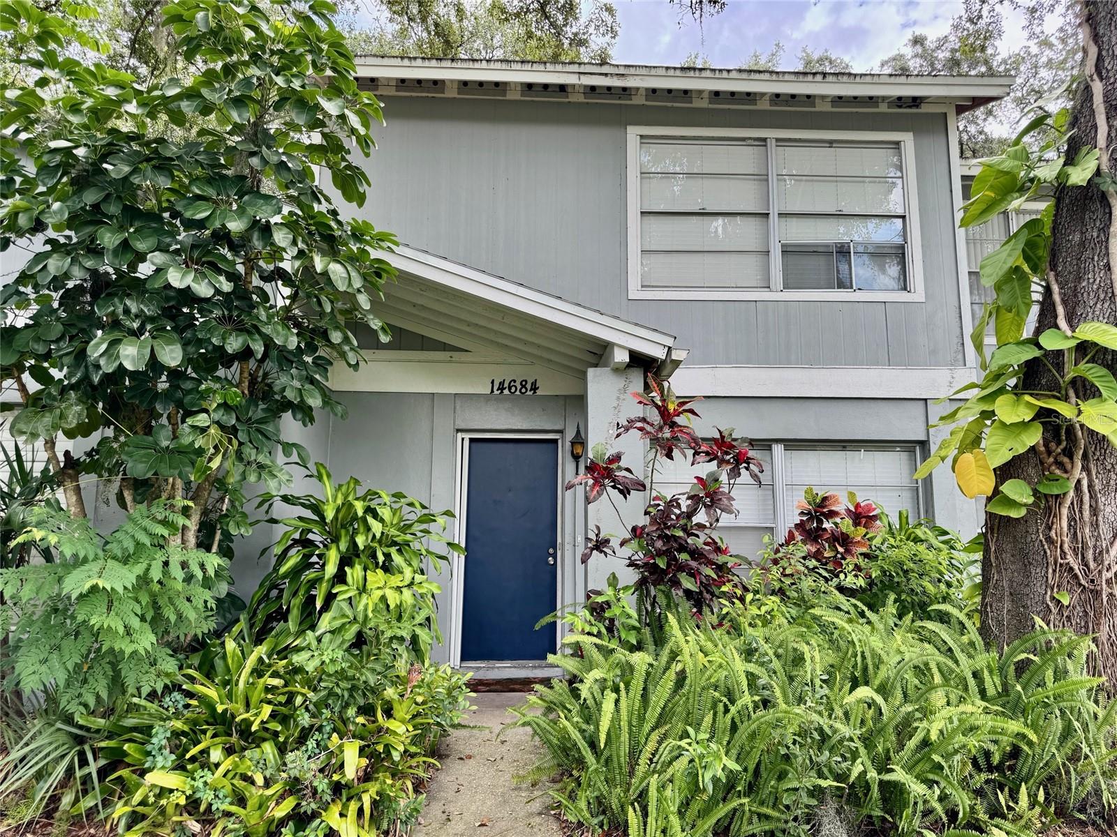 Welcome to this beautiful and freshly painted 2-bedroom, 2-bathroom townhome. The first-floor features ceramic tile throughout, creating a clean and low-maintenance living area. The light and bright kitchen features white cabinets, neutral countertops, and all appliances are included for your convenience. Upstairs is fully carpeted, with the primary suite offering an oversized closet. Enjoy extra living space in the large Florida room/enclosed porch, perfect for relaxing or entertaining. A washer and dryer are also included! Step outside to your private fenced patio, with green space that leads directly to two assigned parking spaces just outside your door. Located in the desirable Lake Forest community, you'll enjoy resort-style amenities including an Olympic-size pool with lake views, tennis courts, basketball courts, pickleball courts, playgrounds, and a hot tub, perfect for active living and everyday enjoyment. Lake Forest is centrally located near USF, VA & Florida Hospital, Moffitt, shopping, restaurants, and so much more. make an appointment today!