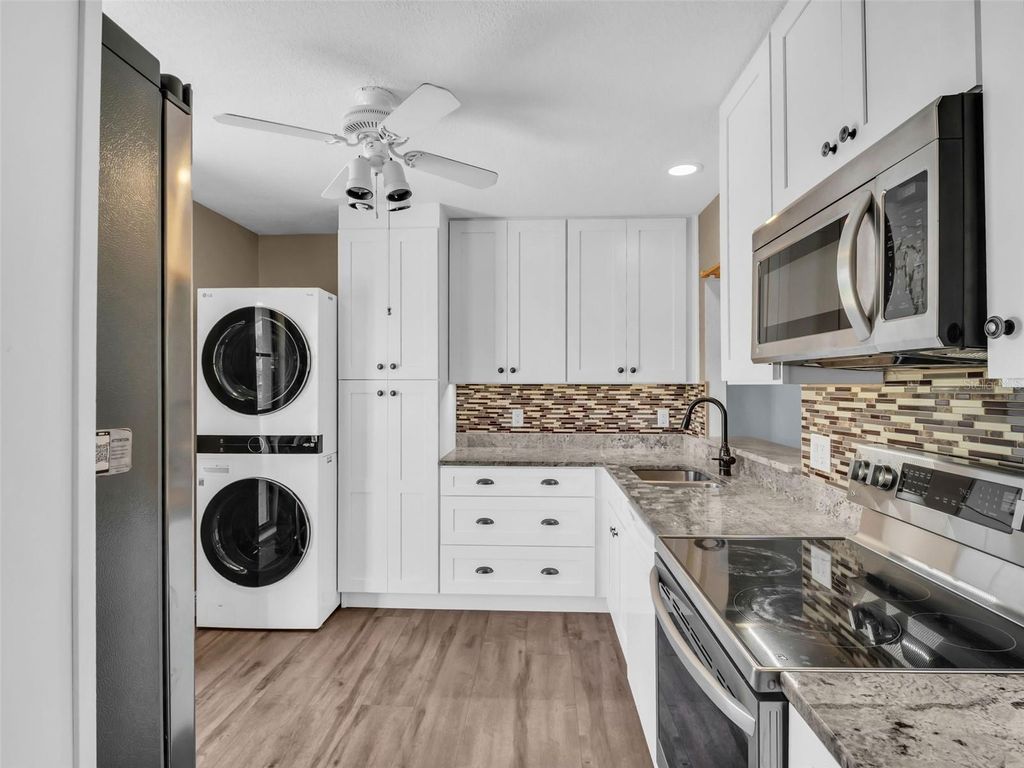 Photo of 25 Windrush Bay Drive #25, Tarpon Springs, FL 34689 (MLS # TB8356761)