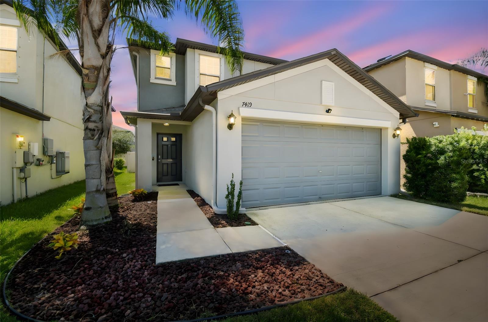 Elegant & well appointed 4-Bedroom Home Built in 2019 in the sought after Touchstone Community of Tampa ($265/year).
Welcome to 7419 Evening Primrose Court, Tampa, FL 33619. A meticulously cared for 4 bedroom, 2.5 bathroom single-family residence offering 2,073 sq. ft. of thoughtfully designed living space. Perfectly suited for families or individuals who enjoy entertaining, or looking for a spacious home This home blends modern comfort with timeless style.
Upon entry, you’re greeted by an open concept layout enhanced by contemporary finishes and an abundance of natural light. The gourmet kitchen is equipped with stainless steel appliances, granite countertops, and plentiful cabinetry, ideal for both everyday living and hosting.
The spacious living and dining areas flow effortlessly, creating a welcoming environment for relaxation or gatherings. Step outside to a covered patio and enjoy the privacy of a fully fenced backyard, complete with durable white vinyl fencing. Your own tranquil Florida retreat.
The generously sized primary suite features a private en-suite bath and walk-in closet, offering a peaceful space to unwind. Upstairs, a versatile loft provides additional functionality, serving as a playroom, office, or secondary lounge. Three additional bedrooms offer flexible options for guest accommodations, remote work, or hobbies.
Ideally located in a quiet yet accessible neighborhood, this home is just minutes from popular destinations like Armature Works, Channelside, Ybor City, Busch Gardens, Tampa Aquarium, Lowery Park Zoo, and Downtown Tampa. With quick access to I-4 and I-75, commuting and travel via Tampa International Airport is a breeze.
Experience the best of Florida living in this move-in ready home. Schedule your private tour today—this opportunity won’t last long!