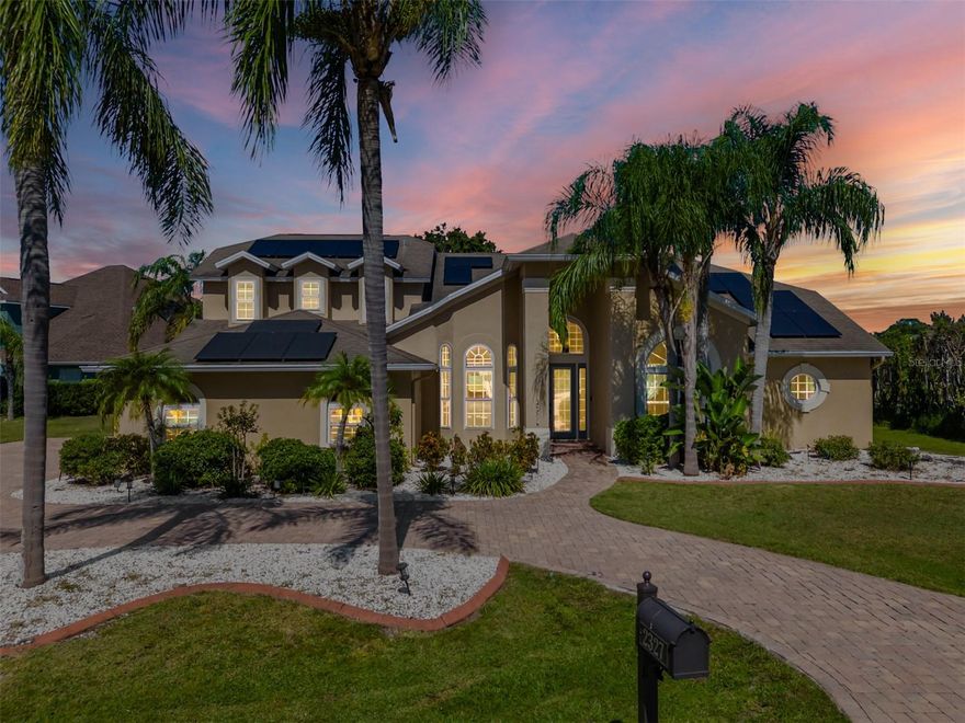 Experience refined lakefront living in this stunning custom-built 5 bedroom, 4 bath + office/study pool home nestled on 2.97 acres in Nature’s Reserve — an exclusive gated enclave of just 16 luxury estates in highly sought-after Land O’ Lakes. With a private dock, community boat ramp, and breathtaking water views throughout, this home offers the ultimate blend of privacy, elegance, and resort-style living.
From the moment you arrive, the impressive paver circular drive sets the tone for the grandeur within. Step inside and be captivated by the bright, open floor plan where panoramic windows and sliders frame an uninterrupted view of the sparkling pool & Spa, lush backyard, and serene lakefront.
To the left the formal dining room has bay windows and walks into the gourmet kitchen that is perfect for entertaining and features 42 inch wood cabinets, granite countertops, custom back splash, under cabinet lighting, breakfast bar, stainless steel appliances, and a large eating area with views out of the bay windows to enjoy that lakefront water view.
The kitchen overlooks the large living room that has built-ins and an electric fireplace for that cozy ambiance.
The large primary suite features wood flooring and has large windows with lakefront water views and has French doors out to the pool/patio area. The primary bathroom includes double vanities with granite counters, walk in shower with tile work to ceiling, and his and her closets.
The first floor 2nd bedroom/Guest Suite includes private full bath and private double door entry to pool area. The additional 1st floor bedrooms are also very spacious with a shared bath!
This home features a 2nd floor that shows a very large 5th bedroom(on floorplan) and full bath with 2 closets, but is versatile to be used as a bonus room, office, guest suite and more. Endless Possibilities! This home even has Solar!
Step outside and unwind in your heated saltwater pool & spa with waterfall, all within a screened, oversized lanai with pavers perfect for year-round entertaining. Enjoy sunsets over the lake, launch a boat from your private dock, or use the community ramp for endless days on the water.
Though tucked away for maximum tranquility, this estate is in a prime location and is conveniently minutes from premier shopping, dining, The Groves, Tampa Premium Outlets, Wiregrass Mall, and major highways for easy access to Downtown Tampa and Tampa International Airport.
If you’re seeking a luxury lakefront lifestyle with space, privacy, and endless entertainment potential — this is the dream home you’ve been waiting for.
Schedule your private tour today — opportunities like this are rare and won’t last!