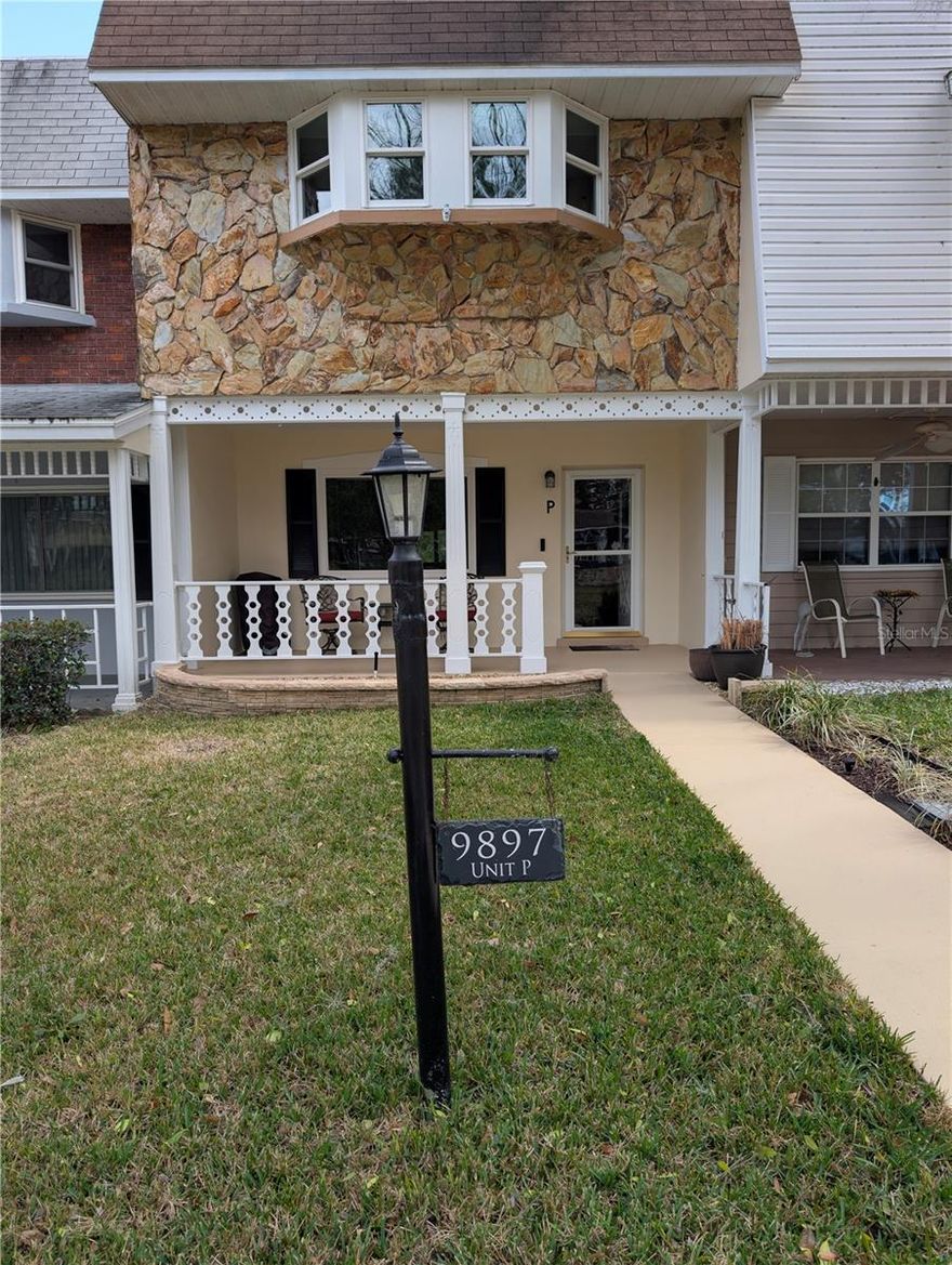 Turn-Key Move-In Ready with a Quick Close Available! This well kept, partially furnished, beautifully updated, charming and spacious home (2050 SF Under Roof) sits in a gorgeous European Style Neighborhood located in a park-like setting with a close by gazebo. This home is conveniently located by golf cart to the front gate, recreation center, pool, golf, fitness, pickleball, fitness centers, softball field, hobby center, racquetball, tennis, ballroom, wood shop, several popular restaurants, banks, Publix and more. Quality updates include: Solid birch wood, cherry stained, kitchen soft-close cabinets with glass door inserts, upgraded kitchen granite countertop with a full height granite kitchen backsplash, updated kitchen sink faucet and garbage disposal, high end kitchen stainless steel appliances including a convection oven, and a reverse osmosis drinking water system. Updated interior trim: crown molding, taller decorative baseboards, decorative window and door trim. Updated electrical outlets and Decora light switches, lever handle door knobs, roof: 2020, hot water heater: 2020, double hung insulated windows throughout: 2020, rear gutter: 2020, front door window insert with blinds inside, 4 Ton HVAC: 2021, exterior paint: 2022, five hands-free smart DC motor ceiling fans, a smart programmable thermostat, upgraded landscaping, a gorgeous Sun Room enclosure (160 SF): 2024-2025. Additionally, bamboo, tile, LVP and laminate floors (No Carpet) and updated stairs with new wrought iron balusters. All baths have updated vanities, sinks, mirrors, faucets, lights, toilets, hardware, paint and trim. A 2025 smart GE Ultrafresh Washer and Steam Dryer. Two parking places and a storage shed. Dual kitchen pantries, a kitchen island, a beautiful crystal chandelier, a wall-to-ceiling wood burning stone fireplace, pre-wired for rear surround speakers, an exterior 4K EUFY Security System with Clear Night Vision are also included features. Conveniently, the HOA covers your lawn mowing, fertilizing, edging and blowing, shrub and tree trimming, roof repairs, exterior building repairs and exterior painting, exterior building insurance, cable TV, lawn sprinklers, lawn irrigation, monitored entry gates, trash and recycling, and access to many enjoyable amenities and clubs. To enhance your lifestyle,the home is partially furnished (a nice second refrigerator, a chocolate loveseat and chair, two end tables, patio set, and two person dining set) and includes a low mileage 2022 Lithium Battery 4 Passenger Golf Cart to help you discover and enjoy the incredible lifestyle that On Top of The World offers you.