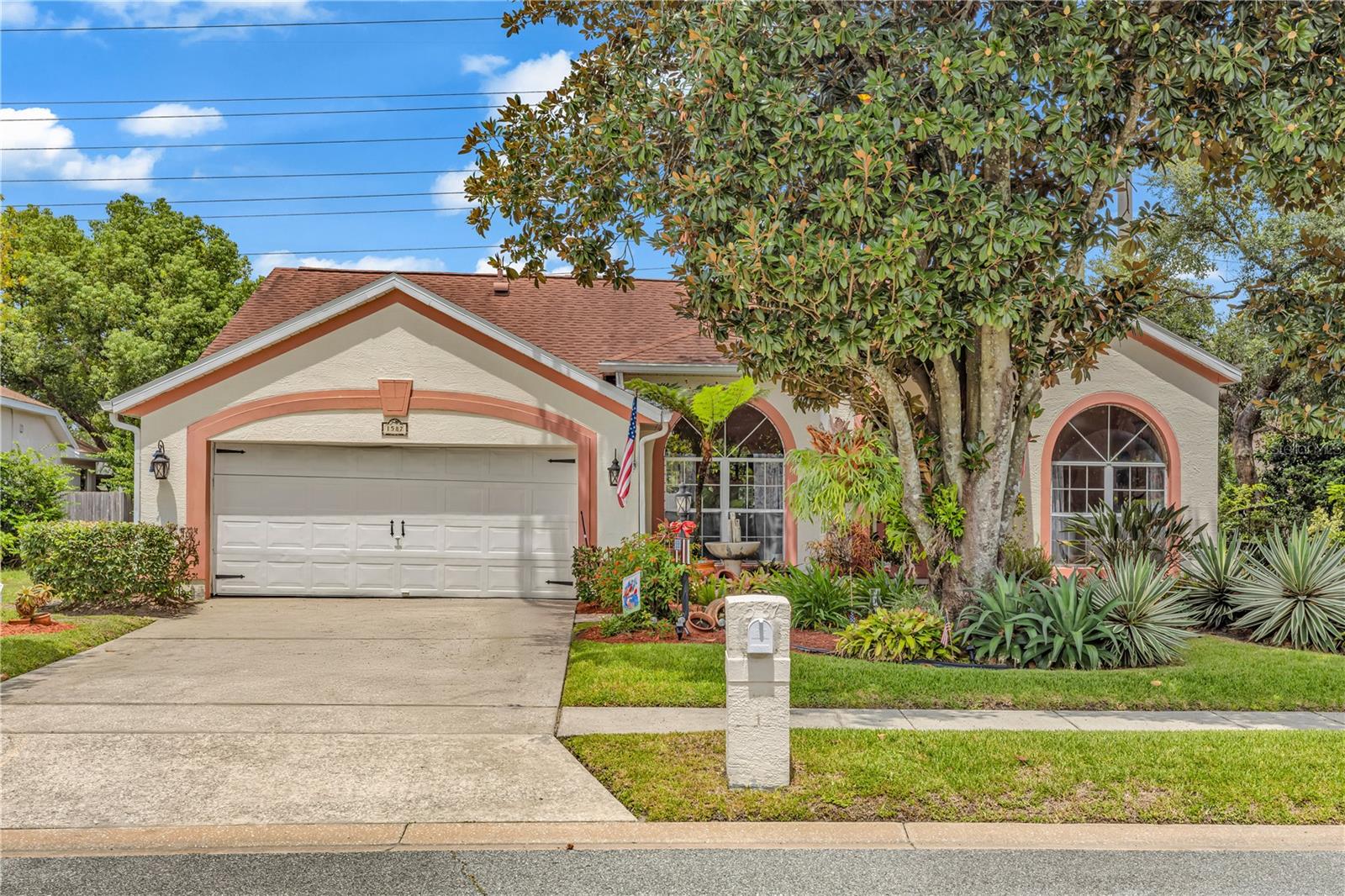 Welcome to 1587 Hunters Stand Run – where charm, space, and comfort meet.
This beautifully designed 4-bedroom, 2-bath home offers a desirable split floorplan and thoughtful upgrades throughout. Step into an inviting open-concept living space that blends the kitchen, family room, and Florida room seamlessly—ideal for both everyday living and entertaining.
As you approach the home, you'll notice the lush front gardens and a covered entryway that not only offers shelter from the rain but also creates the perfect spot for potted plants or a welcoming display. Inside, you're greeted by a formal dining room to the left and a versatile bonus space to the right—perfect for a home office, sitting room, or library.
The kitchen is a standout feature with upgraded butcher block countertops, a farmhouse sink, a large island with seating, and an additional peninsula breakfast bar. A built-in coffee bar adds both charm and convenience, while high ceilings and abundant natural light enhance the spaciousness of the main living areas. The terracotta-hued tile flooring throughout adds warmth and personality, setting this home apart from the typical "white and gray color" interiors.
The primary suite features high ceilings and an en-suite bathroom with a soaking tub, separate shower, and a private water closet. On the opposite side of the home, three additional bedrooms share a well-appointed bathroom with floor-to-ceiling tiled shower and a built-in bench.
Step into the Florida room and out to the fenced backyard—an absolute sanctuary for garden lovers. Meandering paths, cozy seating nooks, and flowering shrubs create a peaceful retreat under the shade of mature trees, including a large avocado tree. Best of all, enjoy privacy with no rear neighbors.
This home is warm, welcoming, and full of character—it’s the kind of place that says, “Come in, relax, and stay a while.”
________________________________________