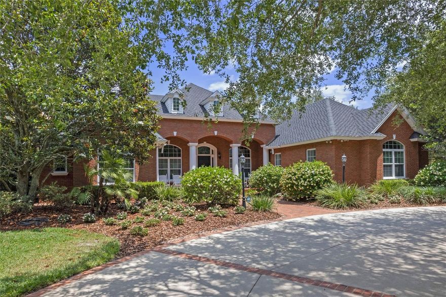 RARE Opportunity…Beautiful LAKEFRONT, CUSTOM BUILT ESTATE on over 5.3 ACRES of completely irrigated and meticulously manicured landscaping, over 150 ft of lake frontage on the pristine SPRING FED and SKIABLE 335 acre Lake Joanna. The primary home has 4 bedrooms (each with their own walk in closet) and 3 full baths at just under 3,800 sq ft. The open floorplan overlooks the large saline SPORTS POOL and HOT TUB. The 1,300 sq ft BAR & BILLIARDS ROOM with an entire second FULL KITCHEN, another FULL BATHROOM and 6 PERSON BAR TOP is perfect for entertaining family and friends. As you walk down the sidewalk to the lake you have an additional outdoor GAZEBO/PATIO with a wood burning brick fireplace, perfect area for a front row view of the PRIVATE LAKE. The lakefront is a white sand oasis with a renovated COMPOSITE DOCK with an ELECTRIC BOAT CRADLE & COVER for your boat and storage for all the lake toys. NEW 50 YEAR CERTAINTEED ROOF on all 4 buildings, 4 NEW HVAC UNITS, CUSTOM CABINETRY, BRAZILIAN CHERRY HARDWOOD FLOORS, CUSTOM TERRAZO FLOORING, pistol range, tennis/basketball court, bocce/horseshoe court, chicken coup, multiple garden areas, hurricane room in the master closet, detached mower shed, Detached workshop (2,250 sq ft) 4 garage stalls wide and 2-3 cars deep with an air conditioned second floor that is approximately 594 sq ft. This entire property (5.3+ acres) is fenced in with an AUTOMATIC GATE and CALL BOX. The owners spared no expense with the landscaping which includes mature and routinely manicured live oak trees, countless Sylvester palms, oversized magnolias, camelias, gardenias, bamboos, dogwoods, citrus trees, avocado trees, blueberries, blackberries, and much more. This fortress of an estate is one of a kind. All 4 buildings are completely built with cinderblock overlayed by brick. It has been carefully maintained since its origination in 2006 by the original owners/builders. This estate is also located in the PERFECT LOCATION! This dream estate is only minutes from DOWNTOWN MOUNT DORA, Downtown Eustis, and Downtown Tavares, Publix, Lowes, Restaurants, Hospital, and much more. Easy access to HW 429, SR 46, and HW 441. Additionally, there is an approximate 1 acre, county approved, split parcel towards the front of the property, which can be split off and sold if buyers desired to in the future. There are truly too many details to list so schedule an appointment today to come take a look.