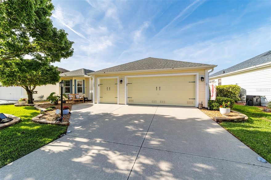 LOW BOND | ROOF 2020 | HWH 2021 | GOLF CART GARAGE | PRIME LOCATION BETWEEN CR 466 & 466A***WOW CURB APPEAL!***This beautifully maintained and updated 3-BEDROOM, 2-BATH CYPRESS Designer home (1,881 sq ft) is ideally located across from Cane Garden Championship Golf Course in the highly desirable Village of Poinciana. From the moment you arrive, you’ll notice the lush landscaping and inviting exterior of this 2-car garage plus golf cart garage home, loaded with upgrades including NEW LVP flooring (2026) in main areas, vaulted ceilings, plantation shutters, upgraded trim, and stunning quartzite countertops throughout. The gourmet kitchen features quartzite countertops, stainless steel appliances including a gas range, oak cabinetry to the ceiling, two pantries, breakfast bar, built-in desk, and designer lighting, while the laundry room continues the elevated feel with custom cabinetry, sink, built-in desk, and quartzite countertop. The spacious primary suite offers two closets and an updated en suite bath with dual sinks, quartzite countertops, and a remodeled solid-surface shower with bench, while the guest bedrooms are generously sized with hardwood flooring and ample closet space. Enjoy year-round living in the enclosed Florida room with an automatic sunshade and designer blinds, and step outside to your private backyard oasis featuring a stucco privacy wall, pergola, waterproof shade sails, and a charming wooden swing—perfect for relaxing or entertaining. Additional highlights include epoxy garage floors, built-in cabinetry with custom workbench, whole-house Kenmore water softener and purifier, and pull-down attic stairs with abundant storage. Conveniently located less than a mile from Allamanda Village Rec Center and Poinciana Neighborhood Rec Center with pools, just a 2.5-mile golf cart ride to Lake Sumter Landing and 5 miles to Brownwood Paddock Square, offering nightly entertainment, dining, and shopping—don’t miss this one, schedule your showing today!