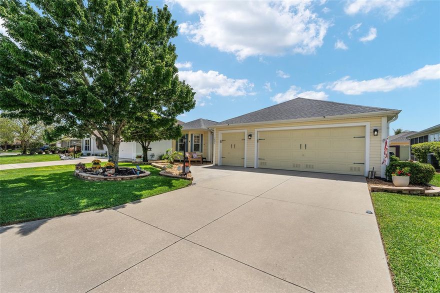 LOW BOND | ROOF 2020 | HWH 2021 | GOLF CART GARAGE | PRIME LOCATION BETWEEN CR 466 & 466A***WOW CURB APPEAL!***This beautifully maintained and updated 3-BEDROOM, 2-BATH CYPRESS Designer home (1,881 sq ft) is ideally located across from Cane Garden Championship Golf Course in the highly desirable Village of Poinciana. From the moment you arrive, you’ll notice the lush landscaping and inviting exterior of this 2-car garage plus golf cart garage home, loaded with upgrades including NEW LVP flooring (2026) in main areas, VAULTED ceilings, PLANTATION SHUTTERS, UPGRADED WINDOW TRIM, and stunning QUARTZITE GRANITE countertops throughout. The gourmet kitchen features quartzite countertops, stainless steel appliances including a GAS STOVE, oak cabinetry to the ceiling, 2 PANTRIES, breakfast bar, built-in DESK, and DESIGNER LIGHTING, while the laundry room continues the elevated feel with custom cabinetry, sink, built-in desk, and quartzite countertop. Enjoy the open dining room and living area—perfect for gathering with friends and family—centered upon the STUNNING OVERSIZED MANTLE AND FIREPLACE. The spacious primary suite offers 2 WALK-IN CLOSETS and an updated EN SUITE BATH with DUAL SINKS, quartzite countertops, and aN UPGRADED SOLID SURFACE PRISTINE SHOWER, while the guest bedrooms are generously sized with hardwood flooring and ample closet space. Enjoy year-round living in the enclosed Florida room with an AUTOMATIC SUNSHADE and DESIGNER BLINDS, and step outside to your PRIVATE BACKYARD OASIS featuring a STUCCO PRIVACY WALLl, PERGOLA, waterproof SHADE SAILS, and a charming wooden swing—perfect for relaxing or entertaining. Additional highlights include EPOXY GARAGE FLOORS, built-in cabinetry with CUSTOM WORKBENCH, whole-house KENMORE WATER SOFTNER AND PURIFIER, and pull-downATTIC STAIRS WITH ABUNDANT ATTIC STORAGE. Conveniently located less than a mile from Allamanda Village Rec Center and Poinciana Neighborhood Rec Center with pools, just a 2.5-mile golf cart ride to Lake Sumter Landing and 5 miles to Brownwood Paddock Square, offering nightly entertainment, dining, and shopping—don’t miss this one, schedule your showing today!